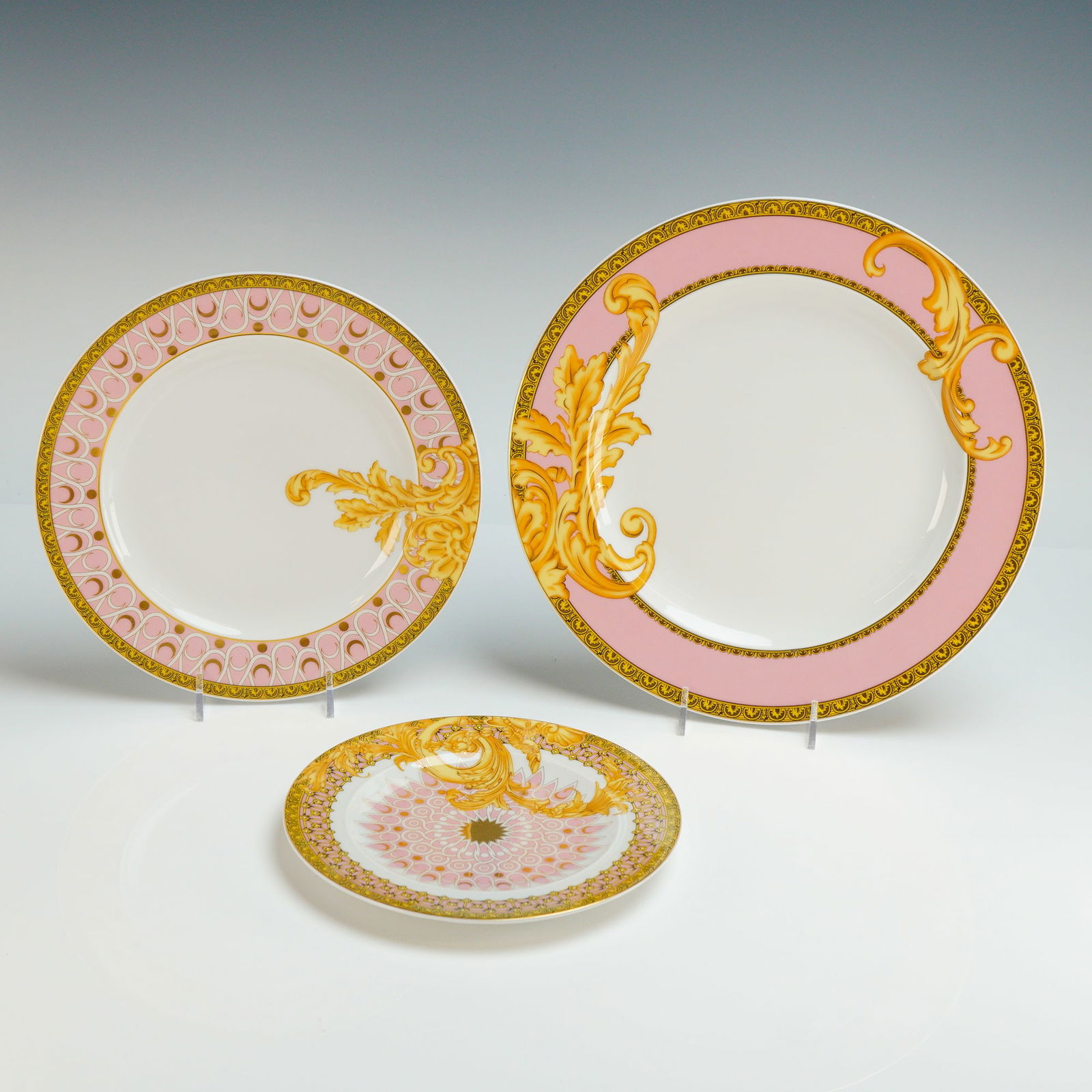 3pc Rosenthal Versace Porcelain Plates, Les Reves Byzanthins: The collection consists of a 10.75" dinner plates, 8.75" salad plate and 7" side plate constructed from glazed porcelain. The design features a palette of pink, white, and gold-toned highlights with B