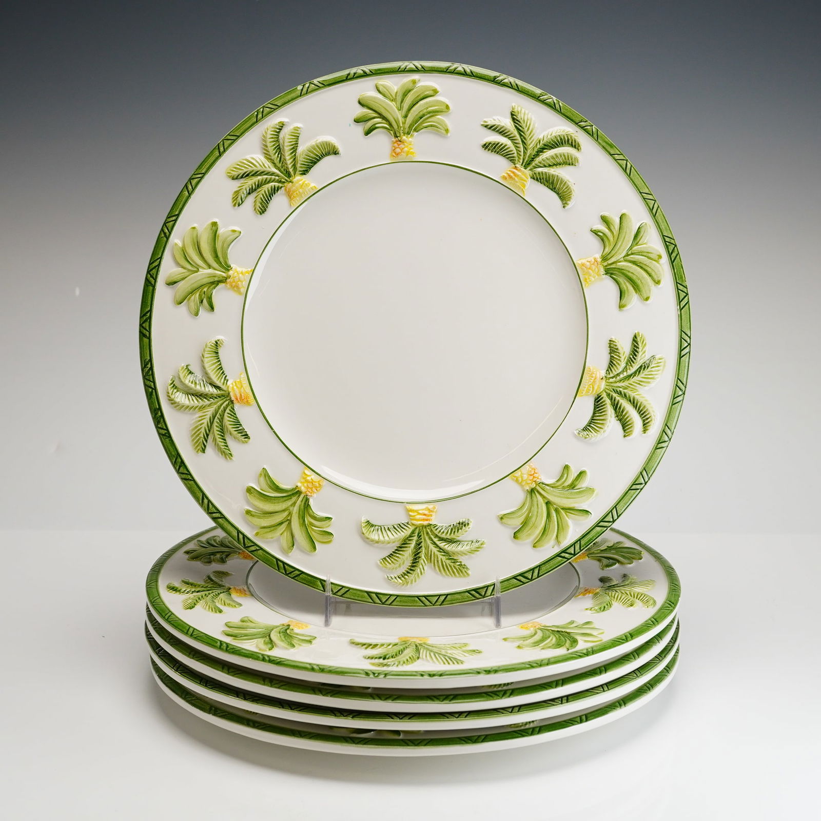 Set of 5 Intrada Palma Dinner Plates: A set of five ceramic dinner plates in the Palma pattern by Intrada. Each plate is constructed of white glazed ceramic featuring hand-painted bas-relief decoration. The rim of each plate is adorned