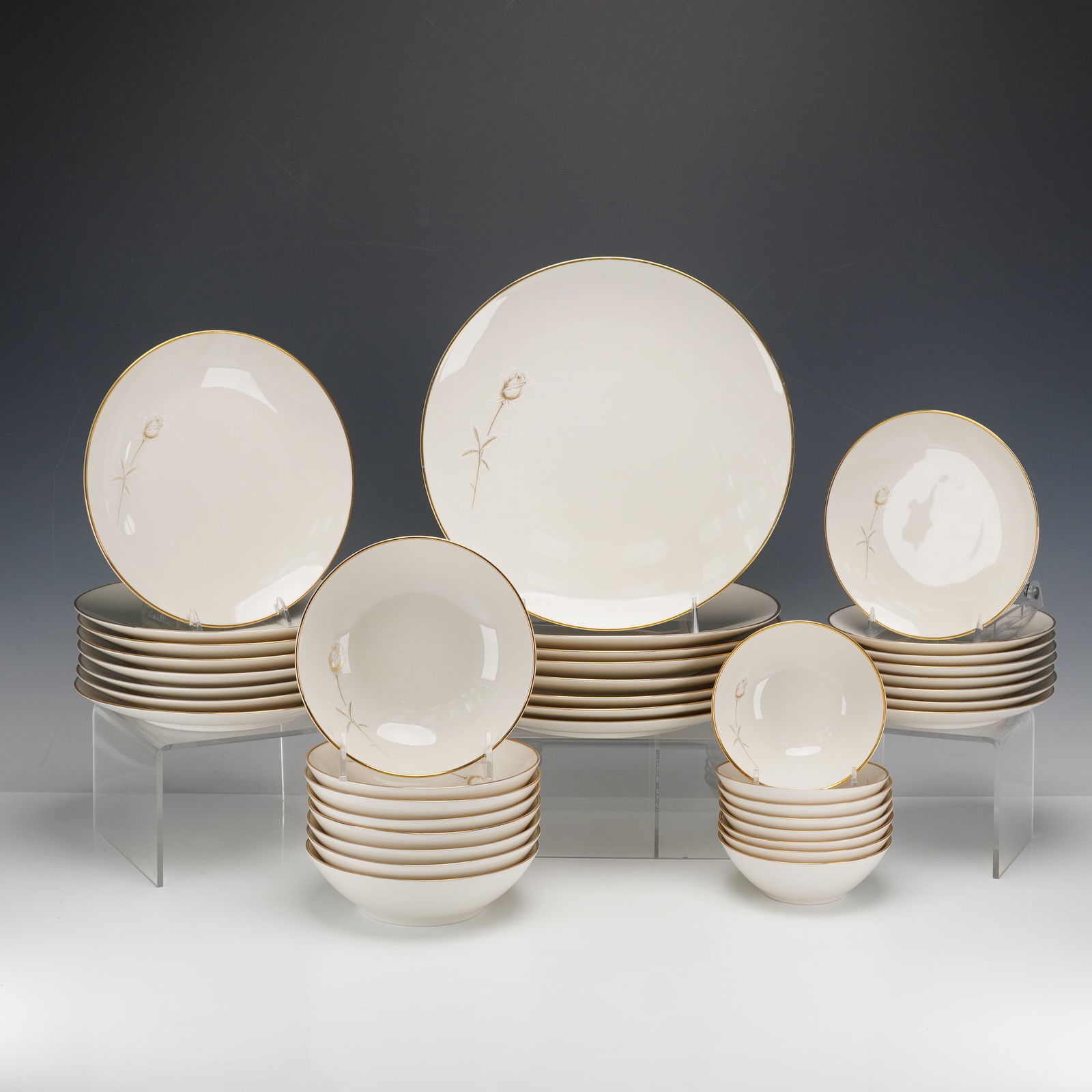 40pc Noritake Ivory-China Dinnerware for Eight, Nora: Collection includes eight dinner plates, eight salad plates, eight bread and butter plates, eight soup bowls, and eight strawberry bowls. The underside is marked "Noritake China, Japan, 7546, Nora,