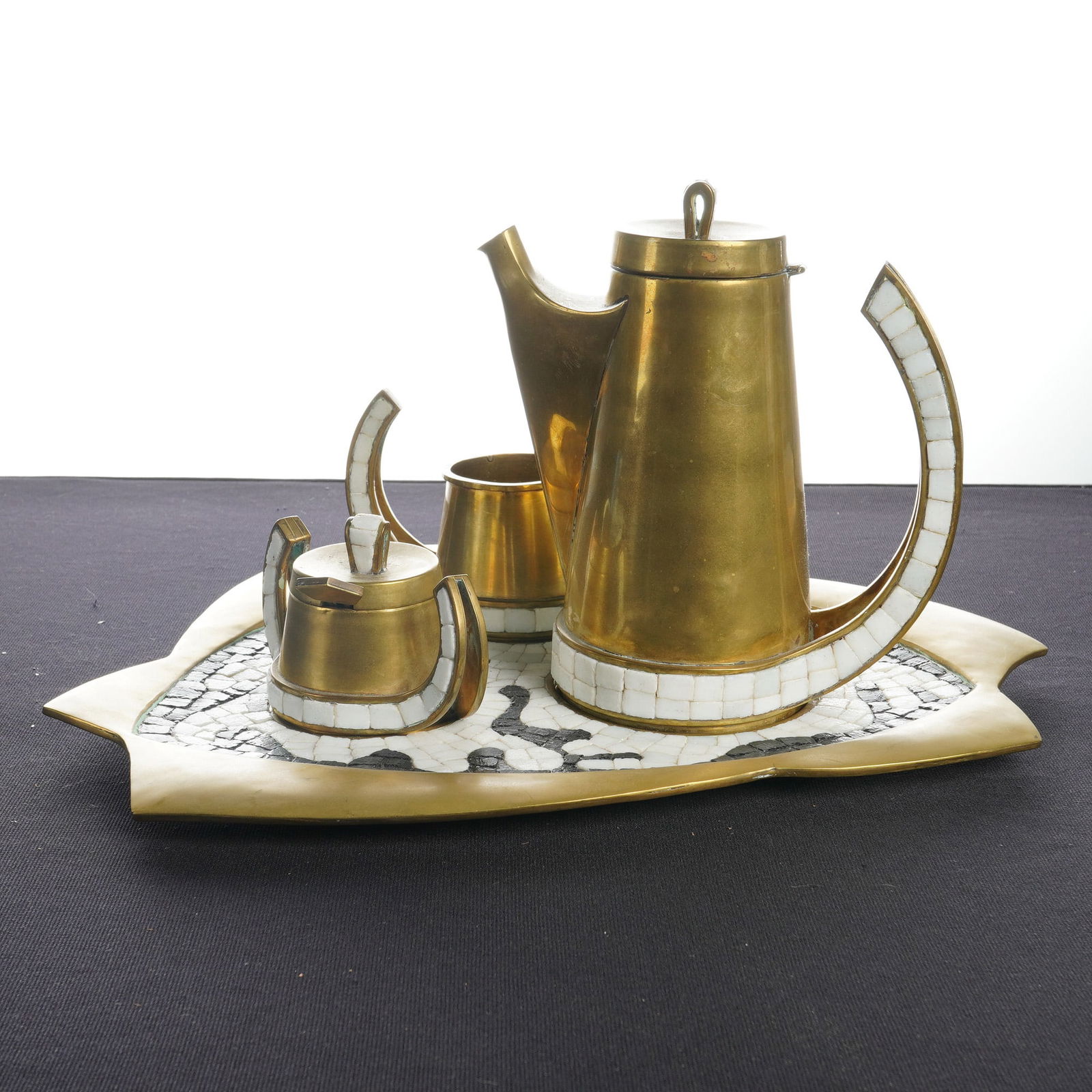 Salvador Teran 5pc Black and White Mosaic Inset Brass Coffee Service: A five-piece coffee service by Salvador Teran (Mexican, 1920-1974) featuring handwrought brass construction with black and white glass mosaic tile insets. The collection includes one coffee pot with