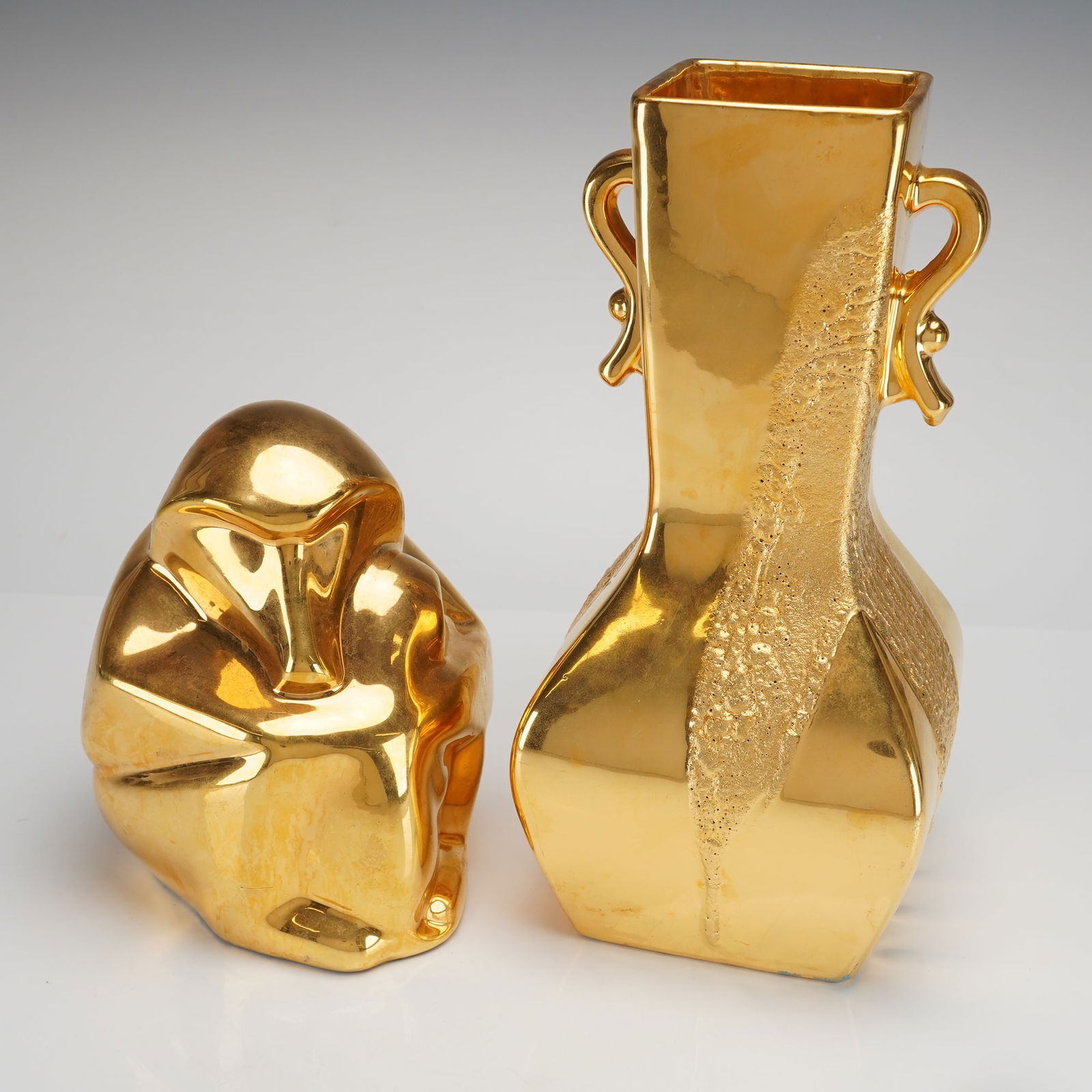 Royal Haeger Vase & Italian Decorative Figure: Two gold-tone decorative objects, comprising one abstract sculpture and one stylized vase. The first object, an abstract, organic sculpture finished entirely in lustrous gold gilt. The base of the scu