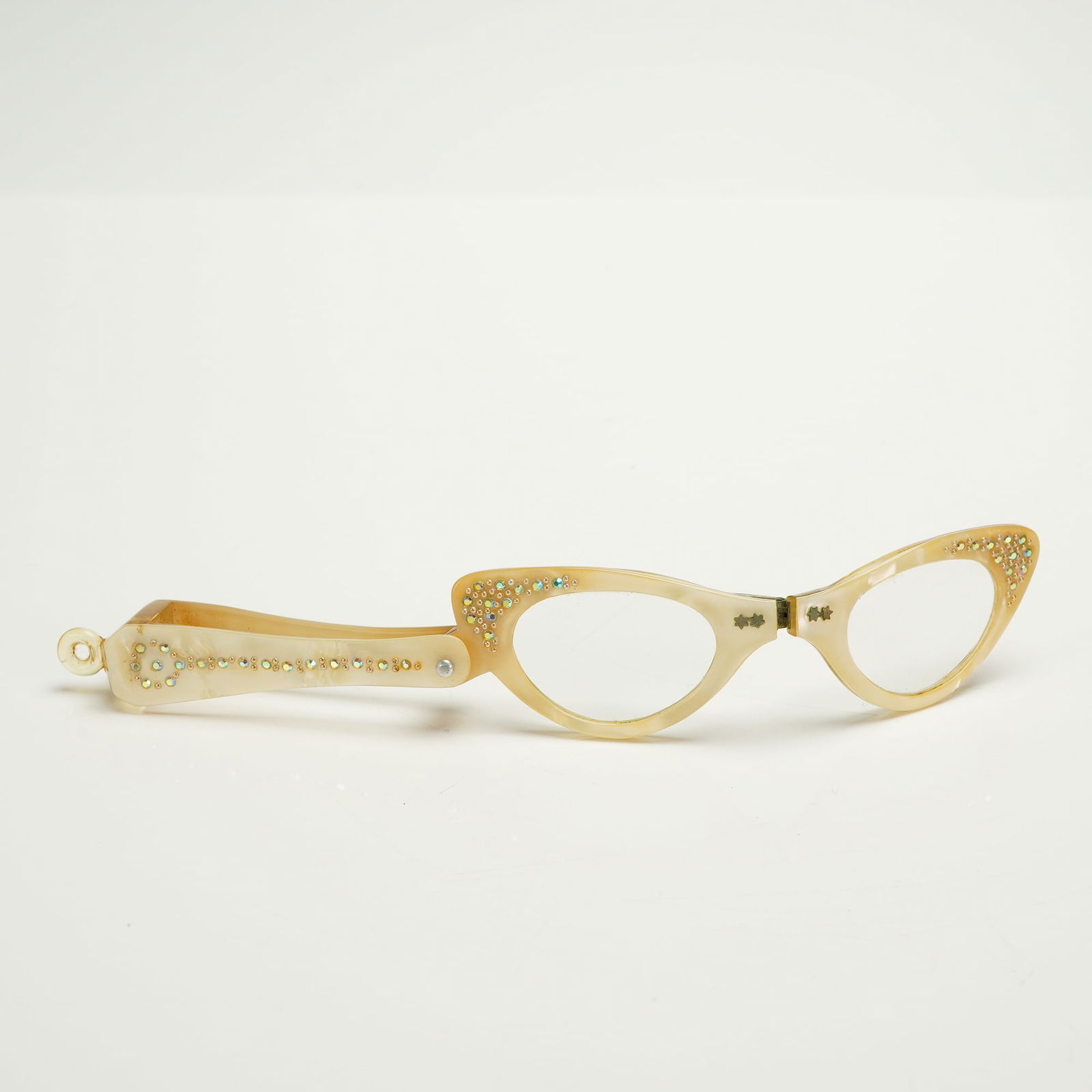 Vintage Folding Cat-Eye Lorgnette Opera Glasses, Rhinestone Embellished: A single pair of vintage folding Lorgnette reading or opera glasses, stylistically dating to the mid-20th century (circa 1950s-1960s). The frames are designed in the cat-eye shape and constructed from