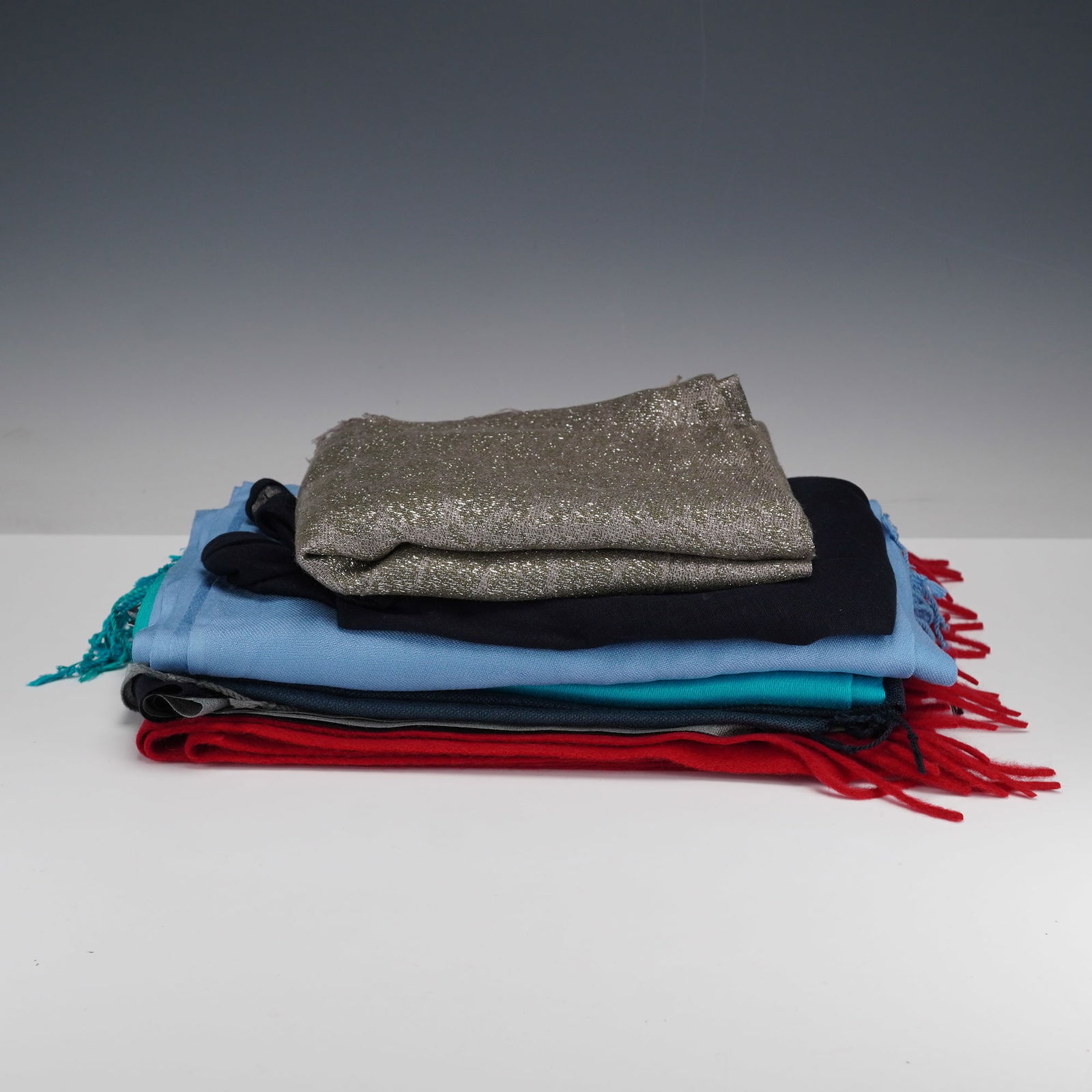 6pc Scarves, Jones New York, Majestic, Phenix: A stylish collection of six scarves, perfect for adding color and elegance to any wardrobe. This lot includes a mix of designer and fashion pieces, with several from Jones New York, known for their ti