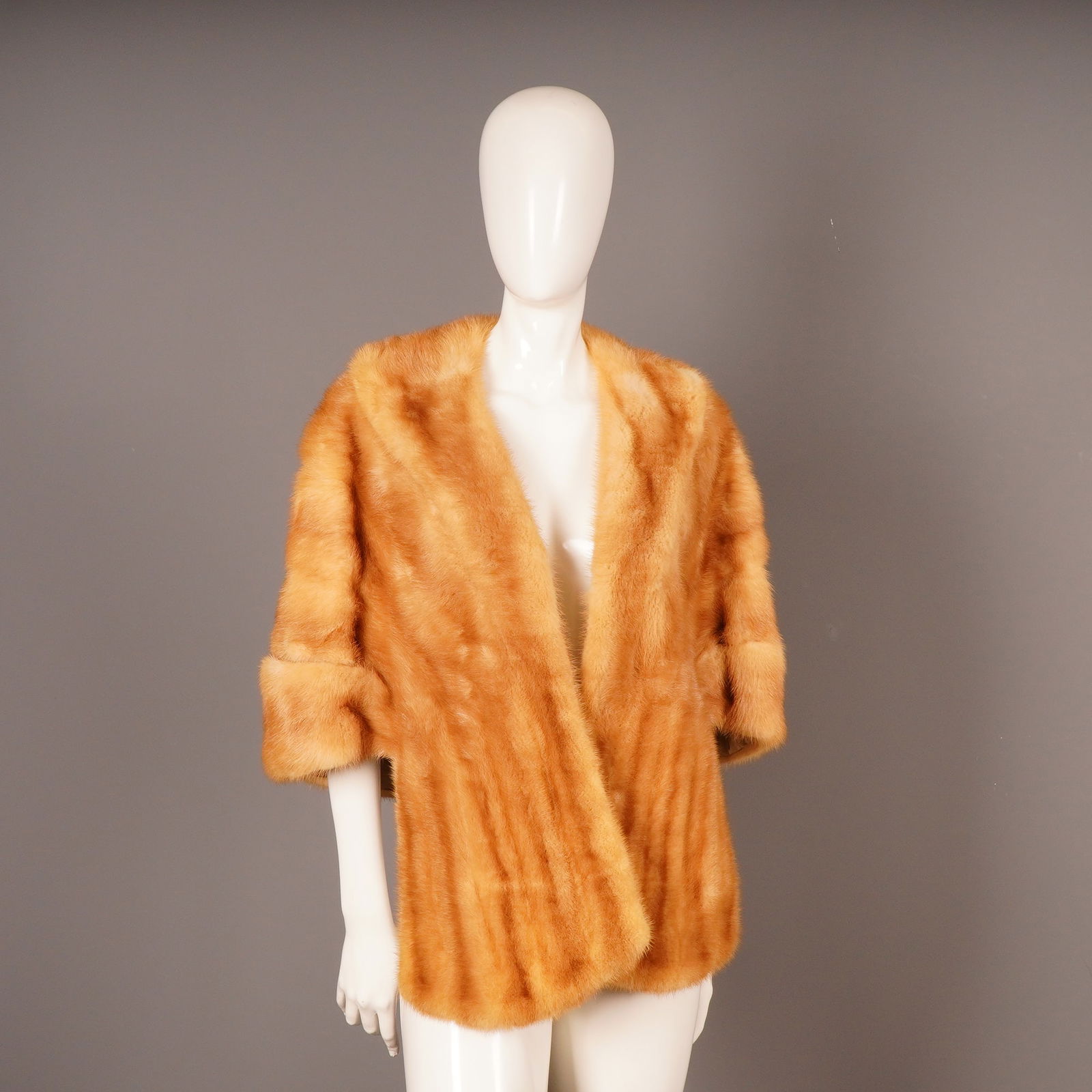 Vintage Albert Furs Amber Mink Stole Bolero: A vintage ladies' fur stole or short capelet, identified as a fur bolero jacket style. The garment is constructed from horizontally stitched pelts of bright orange/amber-colored fur, consistent with n