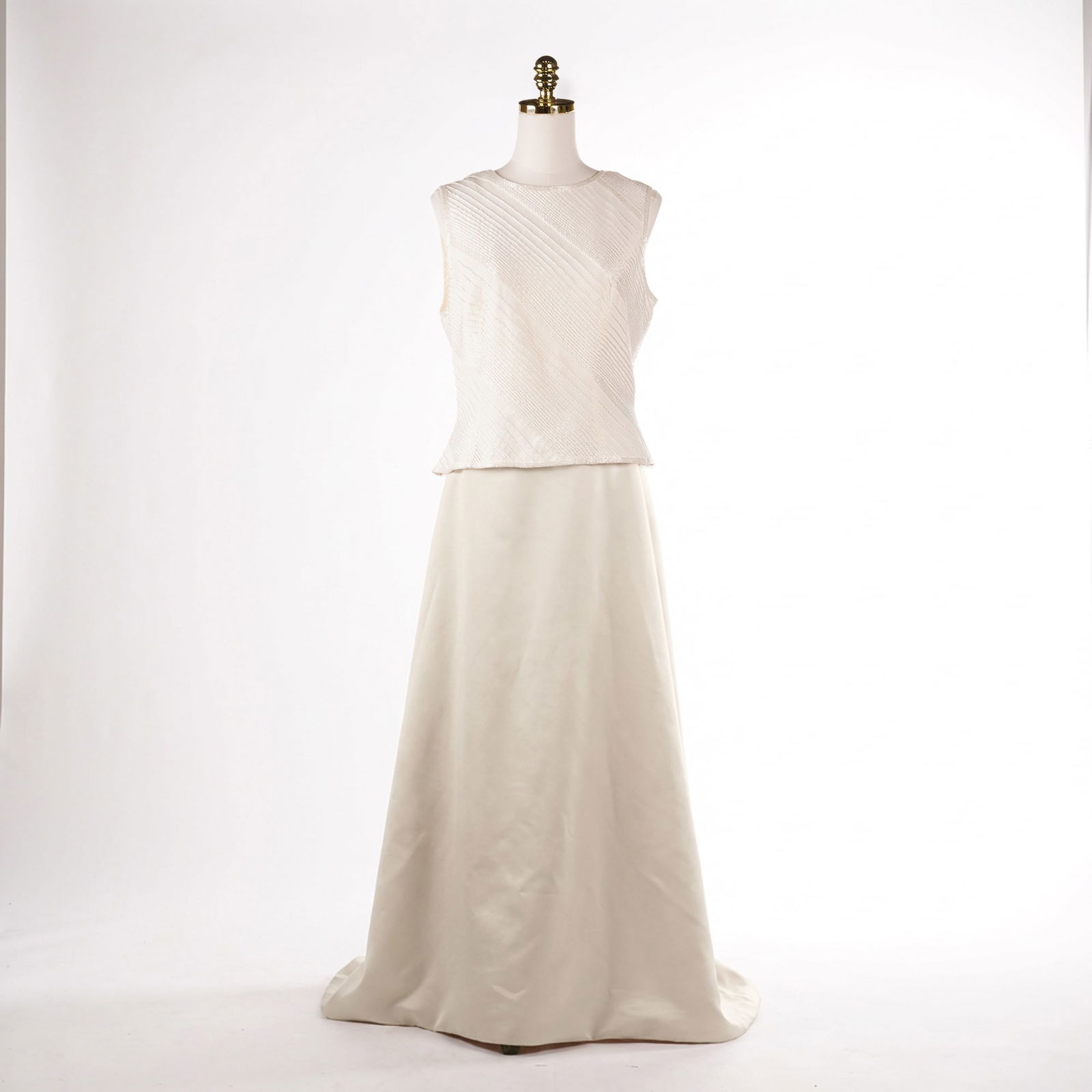2pc Black Tie by Oleg Cassini Off-White Beaded Evening Ensemble: A two-piece off-white evening wear ensemble from the Black Tie by Oleg Cassini line. The set includes one sleeveless top and one coordinating floor-length maxi circle skirt. The top is constructed