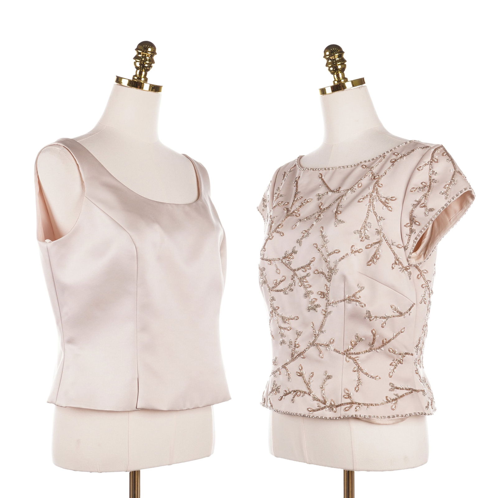 2pc Nahdree Blacktie Off-White Evening Sleeveless Tops: This lot features two Nahdree Blacktie off-white tops that includes one sleeveless satin-finish shell with a scoop neck and a rear zipper closure. Also included is a coordinating short-sleeved blouse