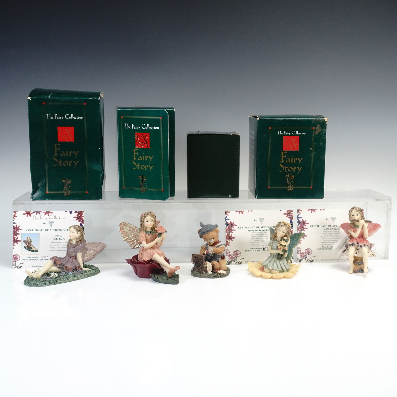 5pc Dezine Ltd. The Fairy Collection Figurines with Boxes: Charming 5-piece set from The Fairy Collection by Dezine Ltd., featuring limited edition hand-painted resin figurines with original boxes and Certificates of Authenticity. The lot includes Rose