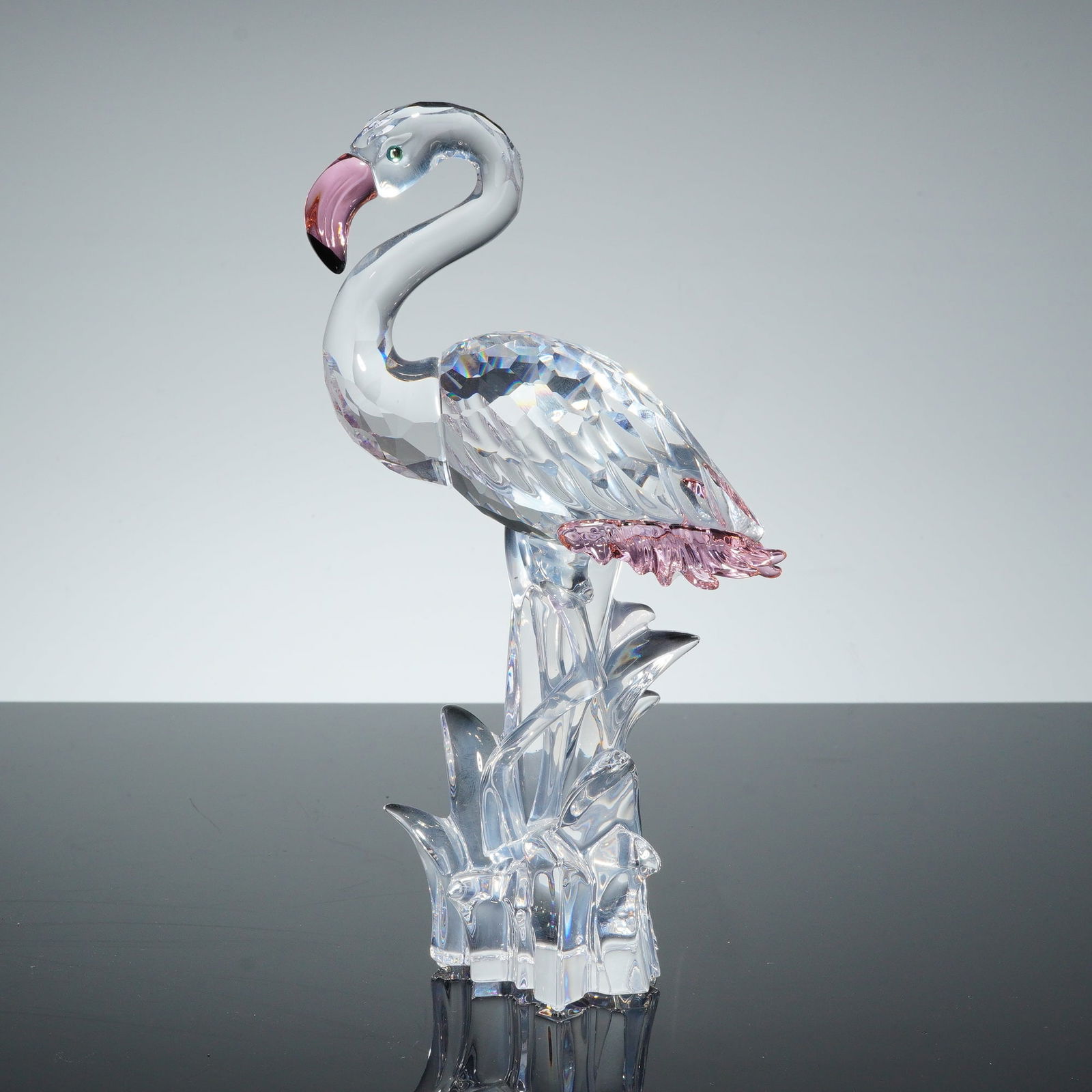 Swarovski Crystal Figurine, Flamingo: Swarovski crystal flamingo figurine featuring clear faceted crystal construction with pink-toned crystal accents on the beak and tail feathers. The figure is depicted in a naturalistic pose atop an in