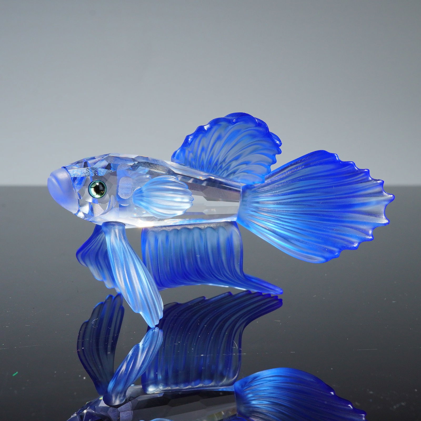 Swarovski Crystal Figurine, Siamese Fighting Fish Blue: A Swarovski crystal figurine depicting a Siamese fighting fish, also known as a betta fish, model number 236718. This piece is part of the South Seas collection. The figurine features a clear faceted