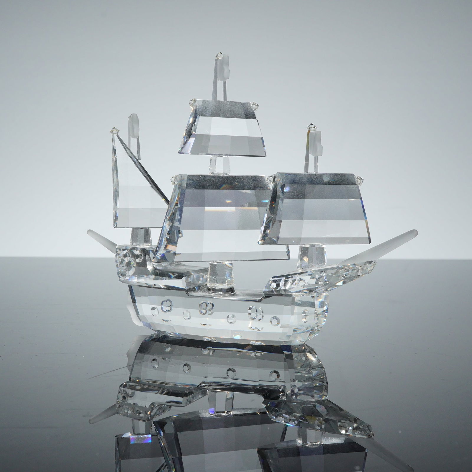 Swarovski Silver Crystal Figurine, Santa Maria Ship: A Swarovski Santa Maria faceted crystal sailing ship figurine from the Silver Crystal collection. The piece is constructed from clear light-refracting crystal and depicts a three-masted vessel. The de