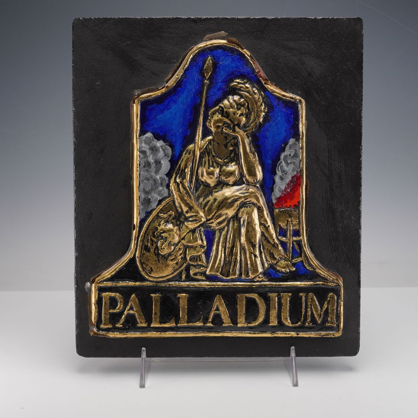 Palladium Insurance by E. V. Jackson Reproduction Fire Mark Plaque: This plaque shows a raised gold colored figure of Pallas Athena seated with a spear and shield against a deep blue background with smoke details on each side. The bottom panel reads Palladium in gold