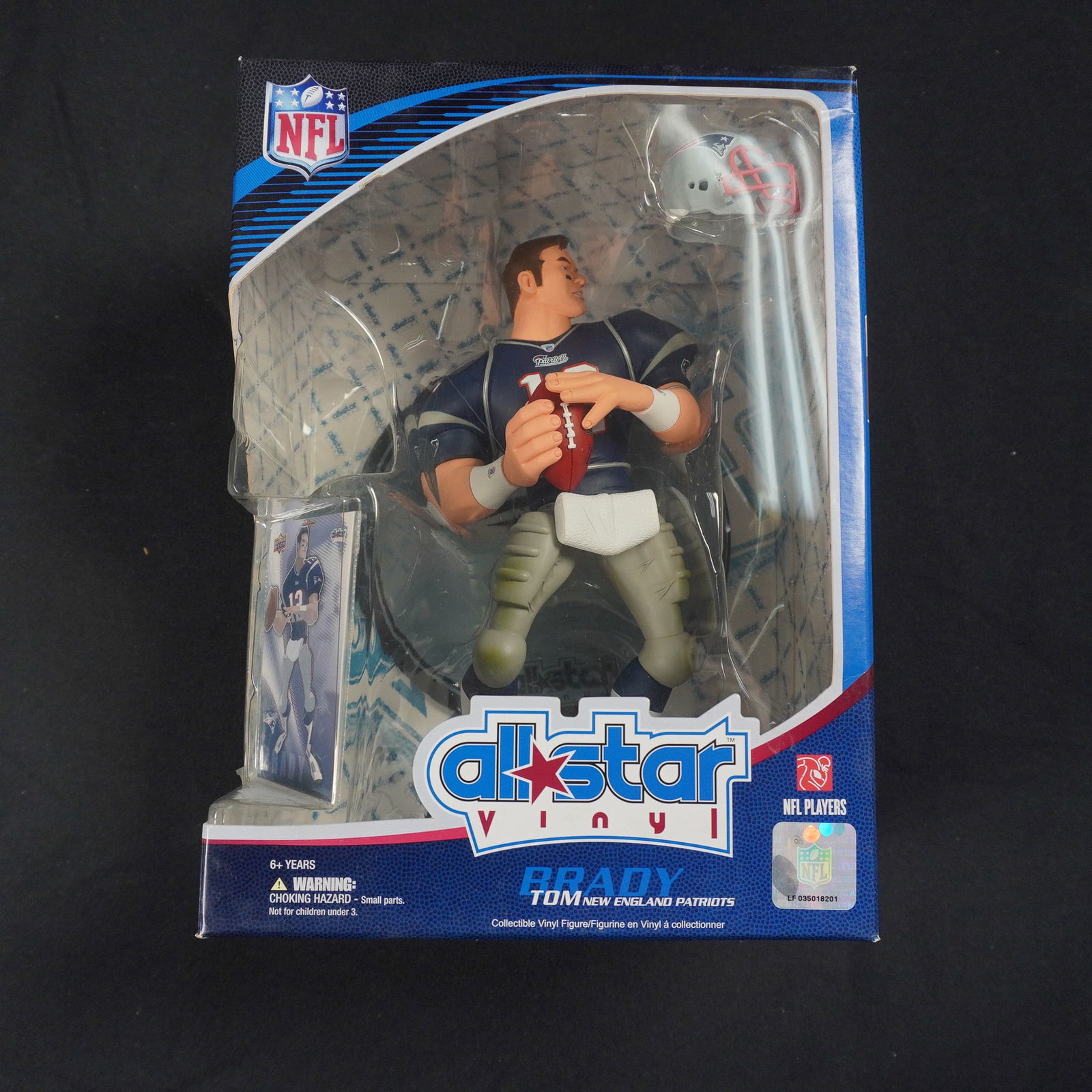 All-Star Vinyl Tom Brady New England Patriots NFL Series 1 Action Figure: This officially licensed collectible features Tom Brady, quarterback of the New England Patriots, in a dynamic pose with a football, stylized in a unique design. The figure comes complete with a mini