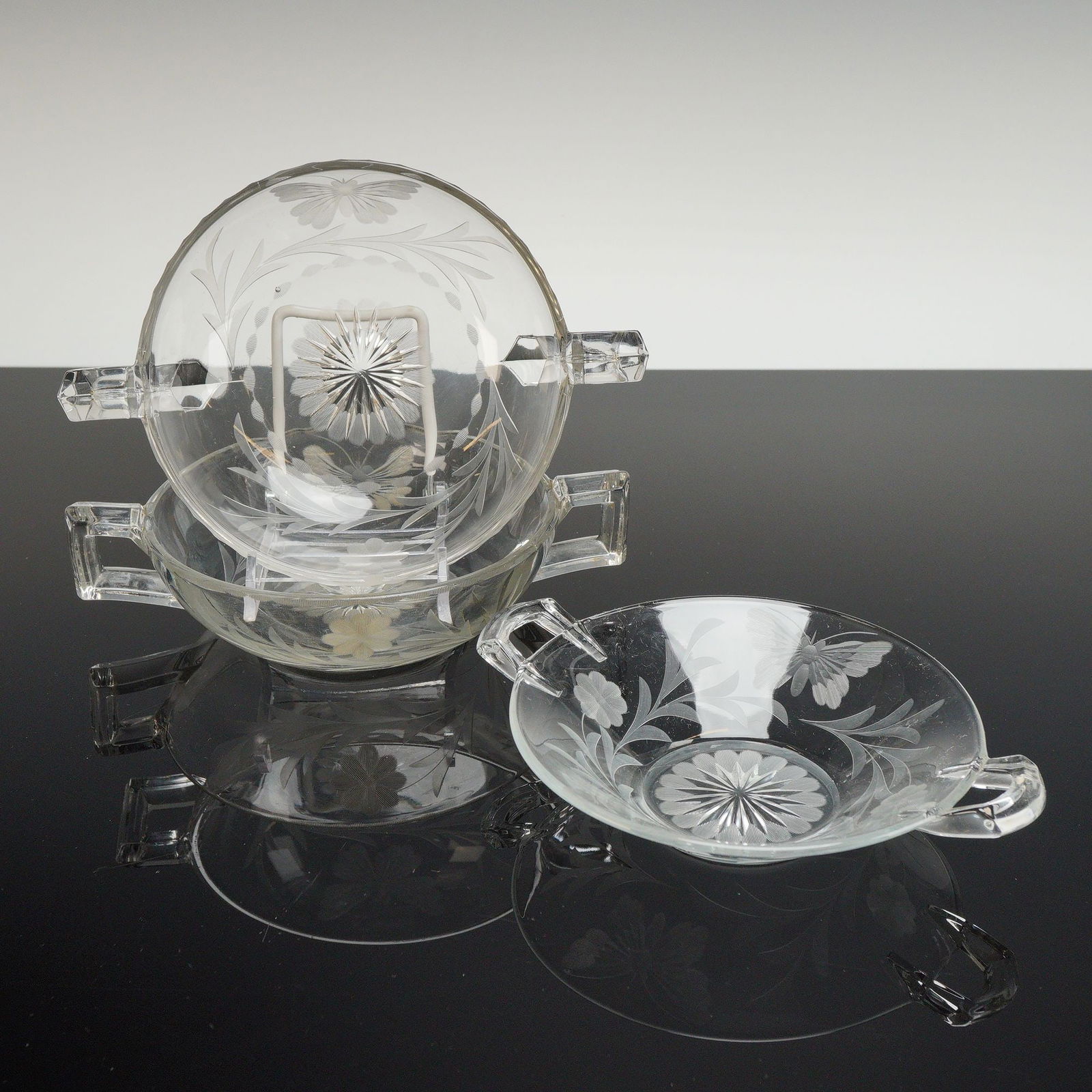 3pc Heisey Orchid Pattern Etched Glass Candy Bowls: A set of three Heisey clear glass candy bowls featuring the Orchid etched pattern. These 3pc etched glass candy bowls are decorated with etched floral and foliate motifs including butterflies and styl