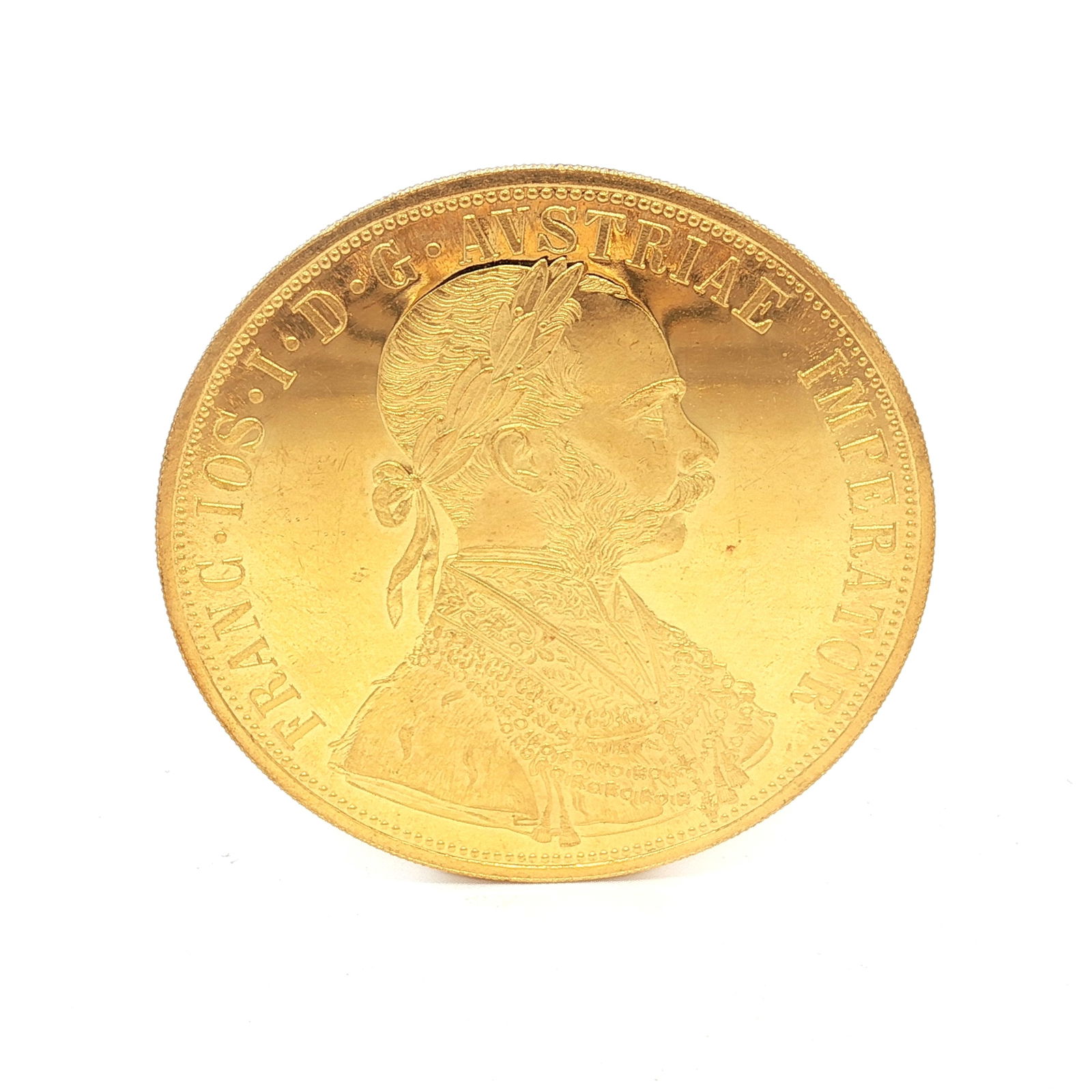 1915 Austrian 4 Ducats Franz Joseph I Replica Gold Bullion: The obverse depicts a right-facing bust of Franz Joseph I with a control mark in the left field. The reverse shows the coat of arms of Austria with order, supported by a crowned double-headed