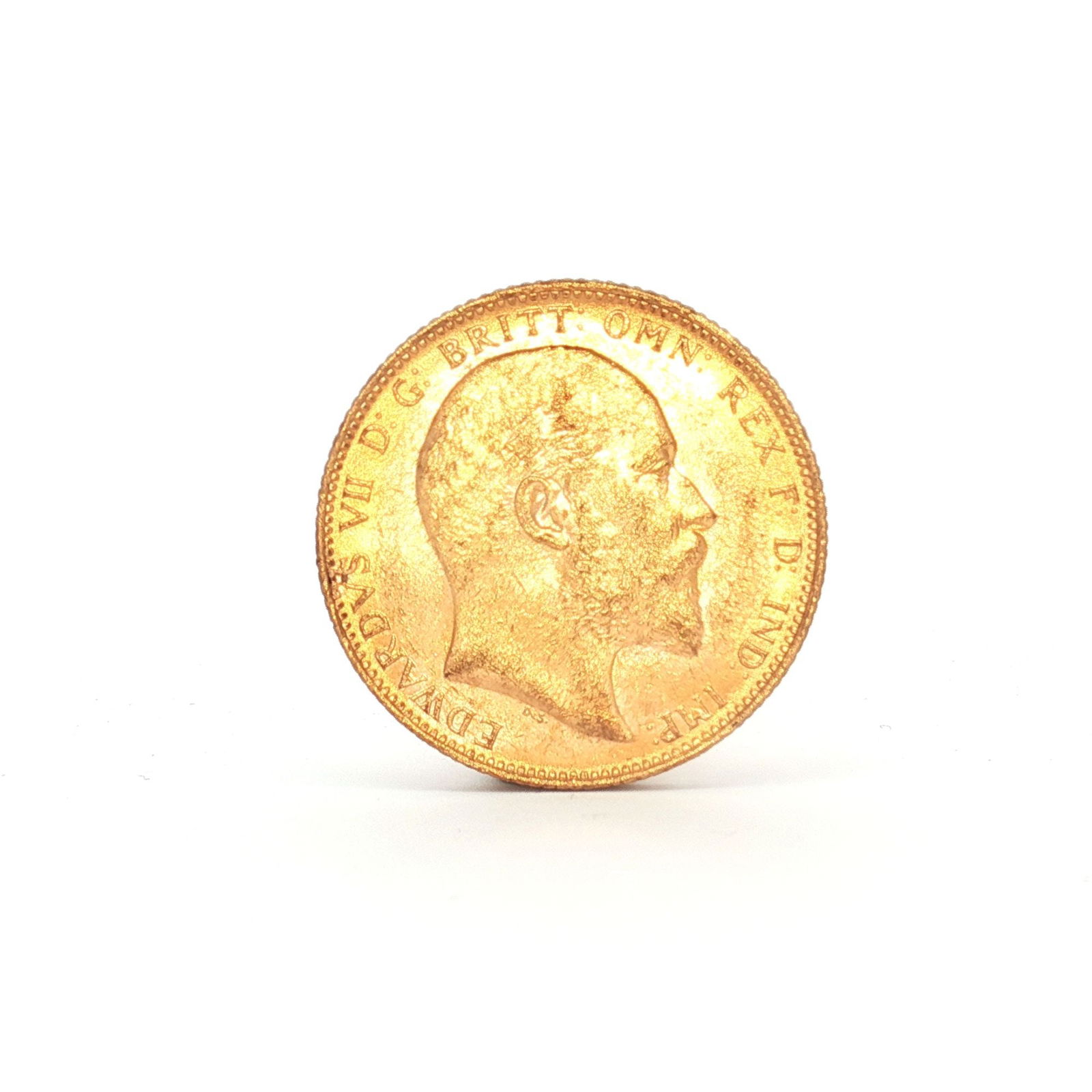 1905 UK 1 Sovereign King Edward VII Gold Coin: 1905 Great Britain 1 Sovereign gold coin produced by the Royal Mint. The obverse presents the uncrowned effigy of King Edward VII facing right, with inscription surrounding. The reverse illustrates