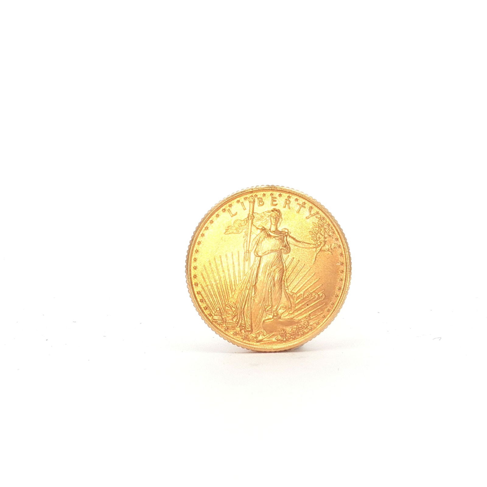 1999 1/10 Fine Gold $5 American Gold Eagle Coin: 1999 $5 American Gold Eagle, 1/10 oz fine gold, struck by the United States Mint. The obverse bears a Liberty effigy with the date 1999, and the reverse shows an eagle flying over a nest, with