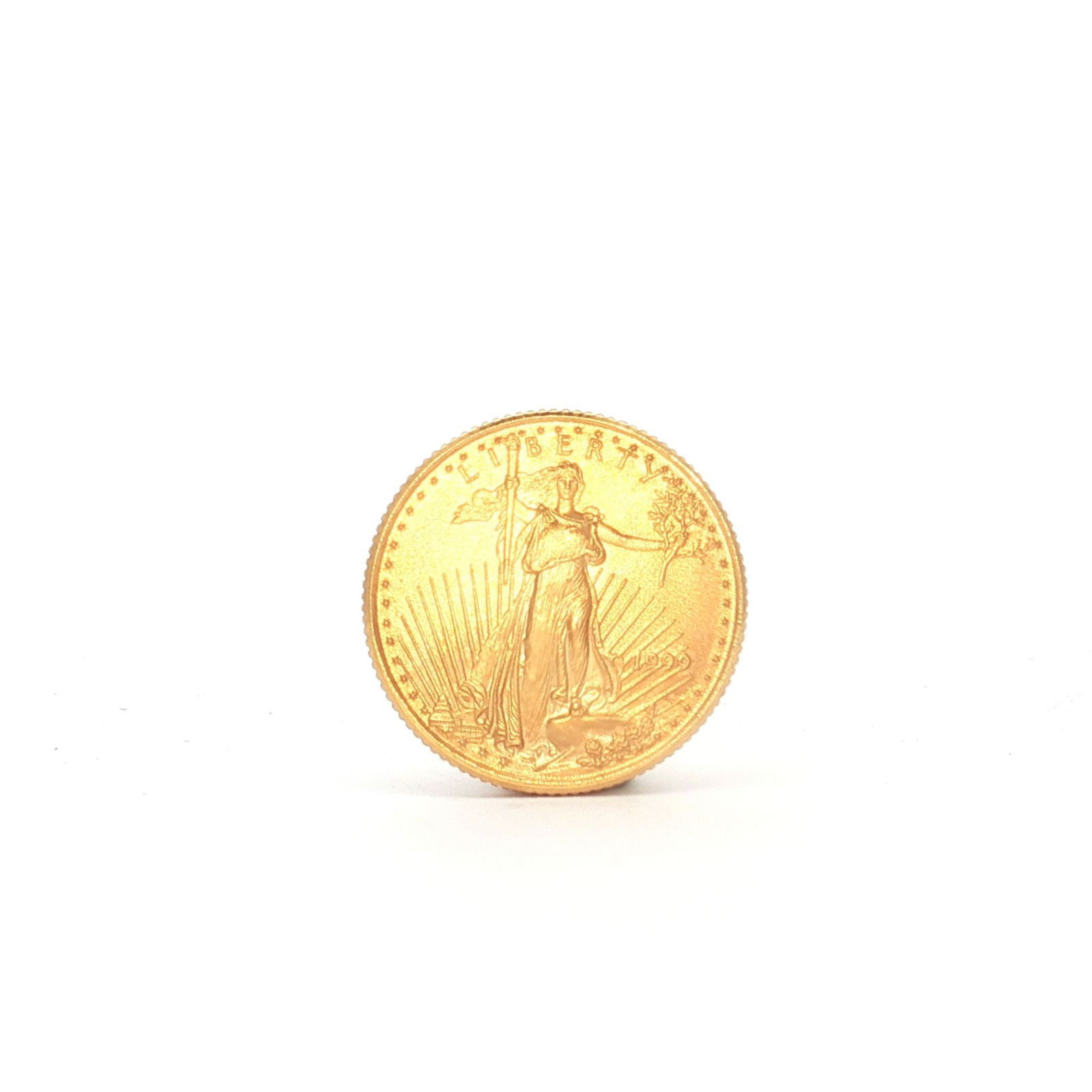 1999 1/10 Fine Gold $5 American Gold Eagle Coin: 1999 $5 American Gold Eagle, 1/10 oz fine gold, produced by the United States Mint. The obverse presents a Liberty effigy with the date 1999, and the reverse illustrates an eagle flying above a nest,