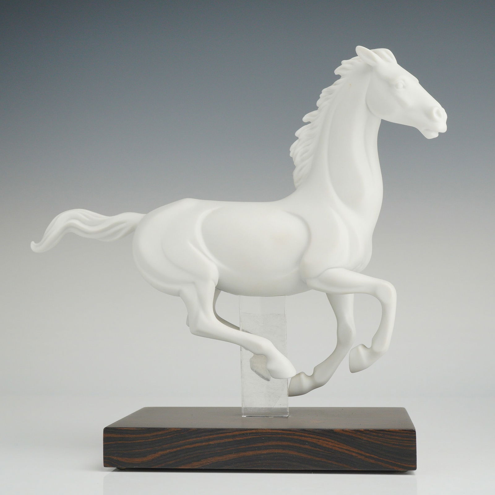 Lladro Horse Figurine, Gallop IV 1016957: A Lladro matte white porcelain figurine titled Gallop IV, number 1016957, part of the Movement Collection. The piece depicts a horse in mid-gallop with stylized anatomical features and a smooth, ungla
