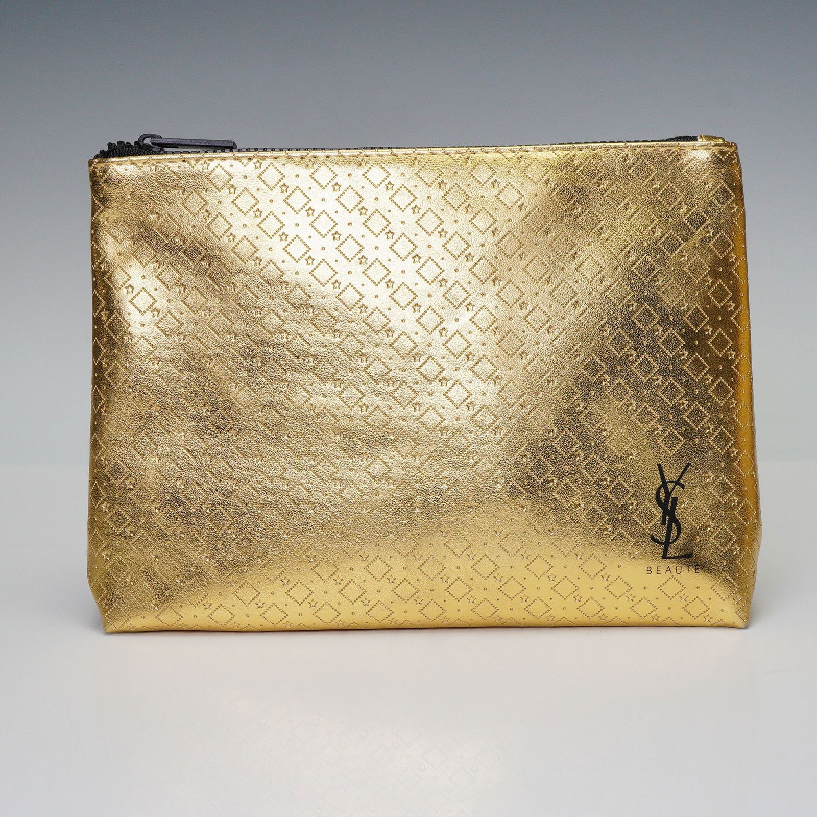 Yves Saint Laurent Beaute Gold Cosmetic Pouch with 3 Lipsticks: An Yves Saint Laurent YSL Beaute gold-toned cosmetic pouch, crafted from a metallic faux leather or fabric, featuring an all-over raised or embossed diamond pattern composed of small dots,