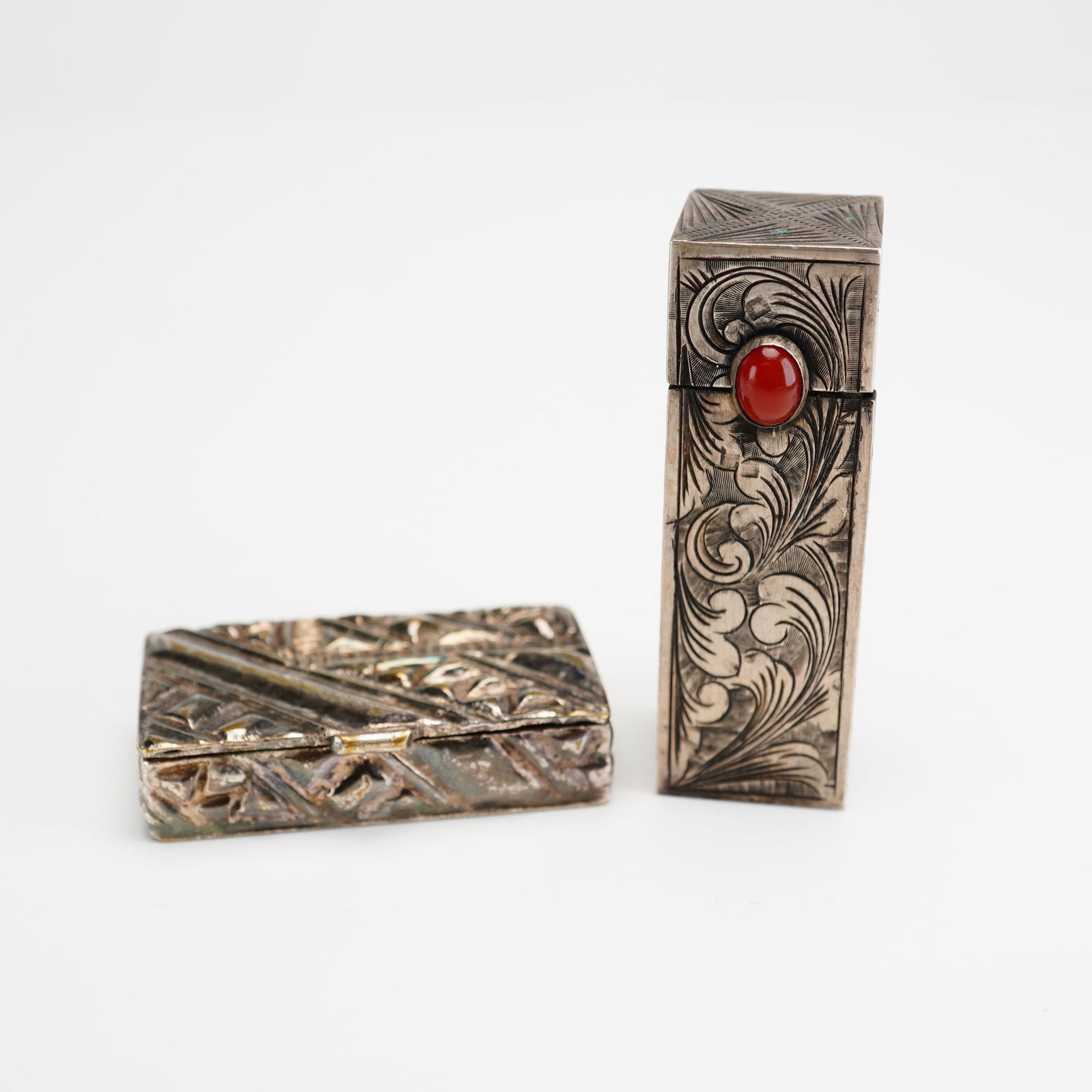 2pc Silver Lipstick Holder and Israeli Keepsake Box: This collection of two boxes includes a rectangular silver lipstick holder and a smaller hinged silver-toned box. The lipstick case features a sliding top that reveals the lipstick inside, as well as