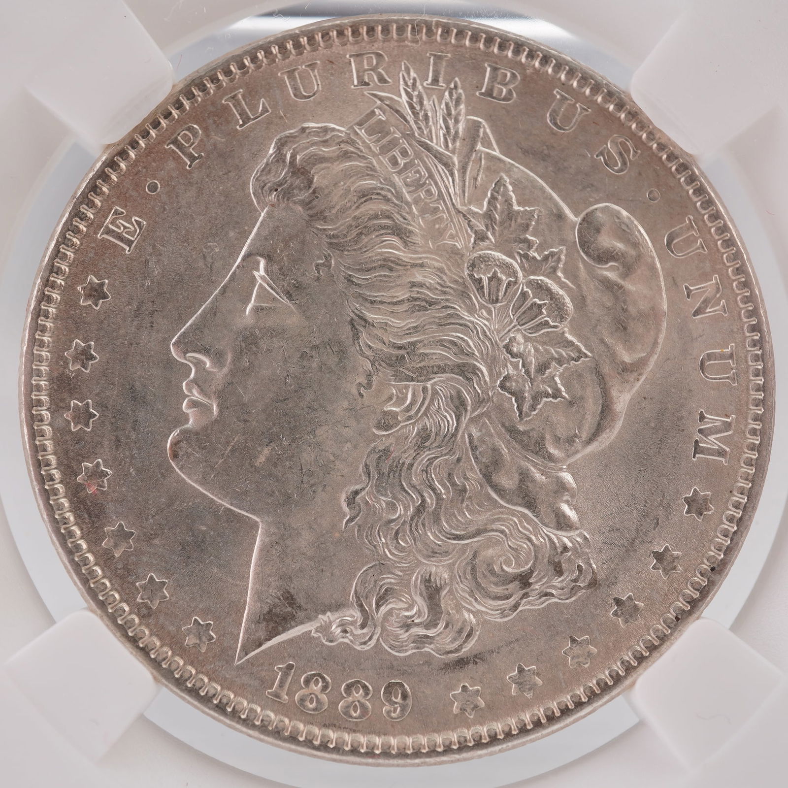 1889 Morgan Silver Dollar: Composed of 90% silver and 10% copper, with a total weight of 26.73 grams containing 0.7734 troy ounces of pure silver. The obverse features a left-facing portrait of Liberty wearing a Phrygian cap ad