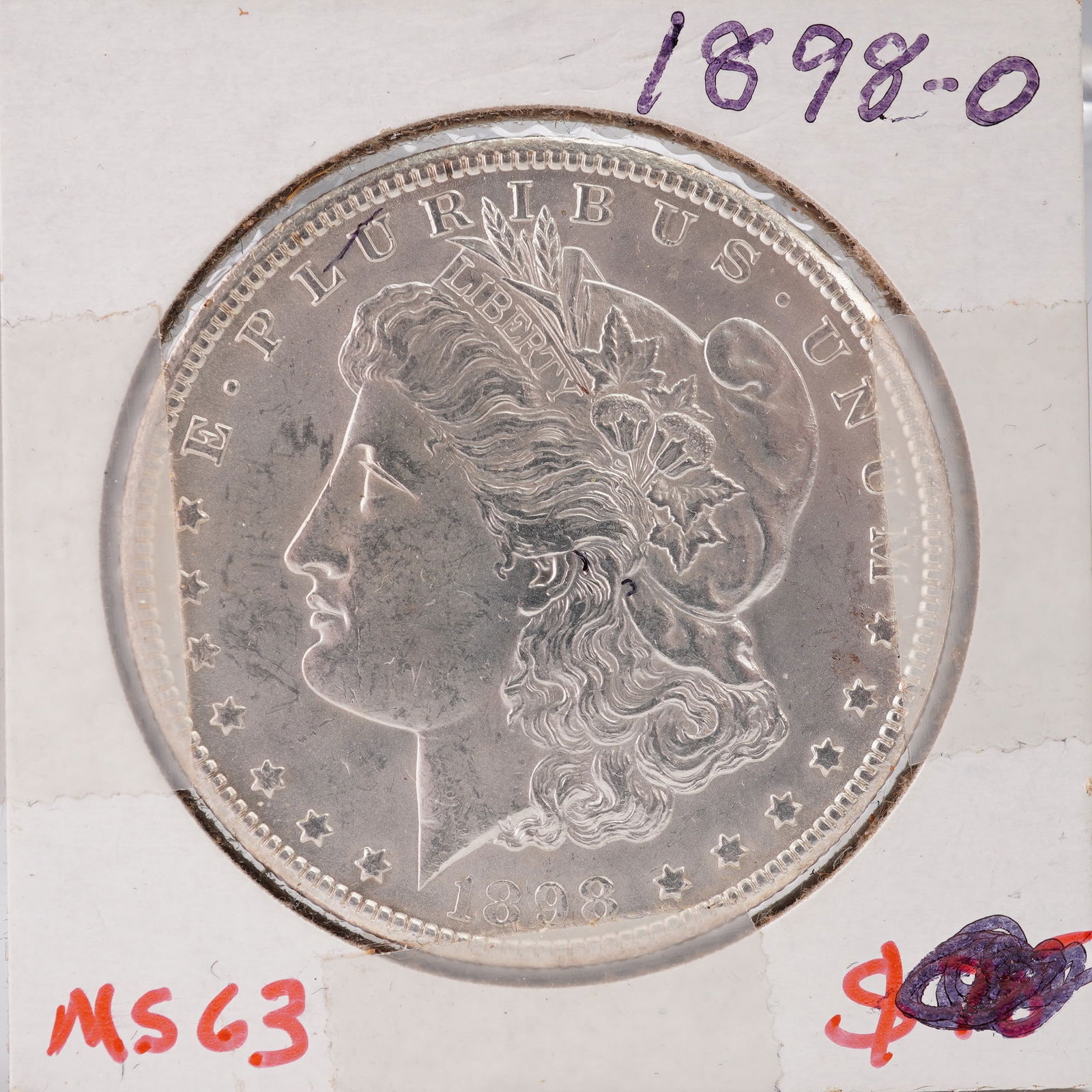 1898-O Morgan Silver Dollar: Struck at the New Orleans Mint, this coin contains 0.77344 troy ounces of .900 fine silver and .100 copper, with a total weight of 26.73 grams. The obverse features the left-facing profile of Liberty
