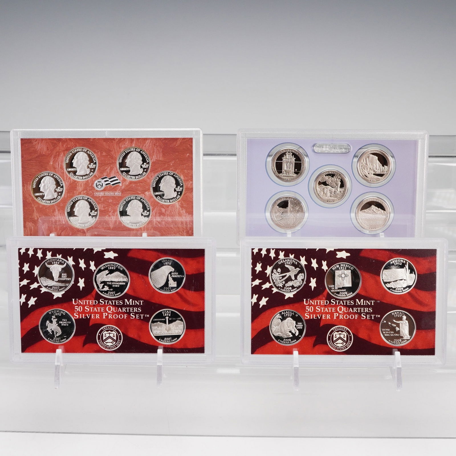4pc 2007-S to 2010-S United States Mint Quarter Proof Sets: This lot contains four United States Mint quarter proof sets, each struck at the San Francisco Mint and bearing the "S" mint mark. Included is the 2010 America the Beautiful Quarters Proof Set in clad