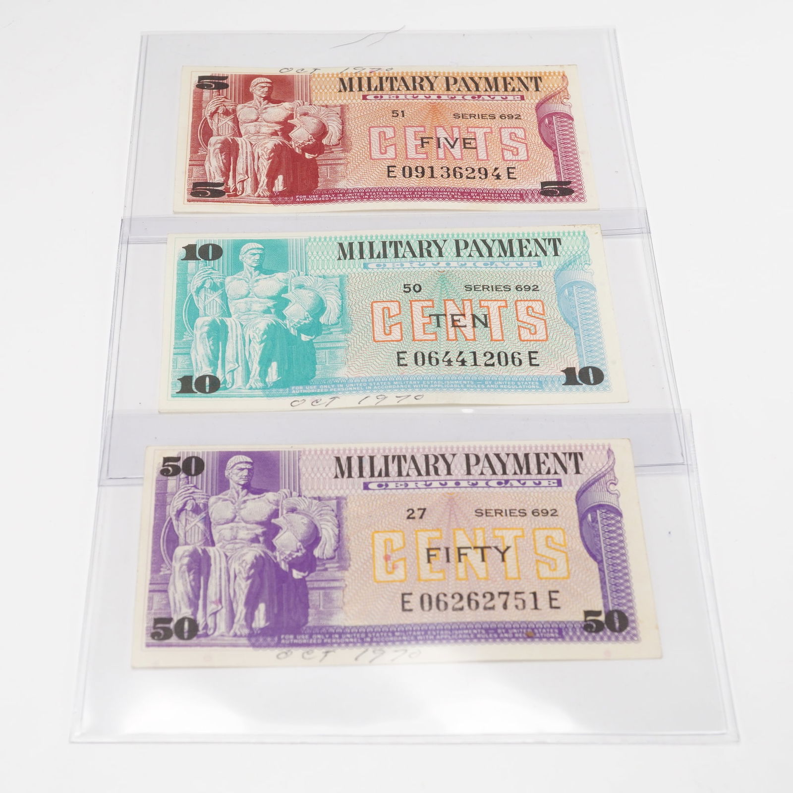 3pc Military Payment Certificates, Series 692- 5, 10, 50 Cents: Set of three U.S. Military Payment Certificates, Series 692, issued in the late 1960s for use by American service members stationed overseas. Denominations include 5 cents (red), 10 cents (green), and