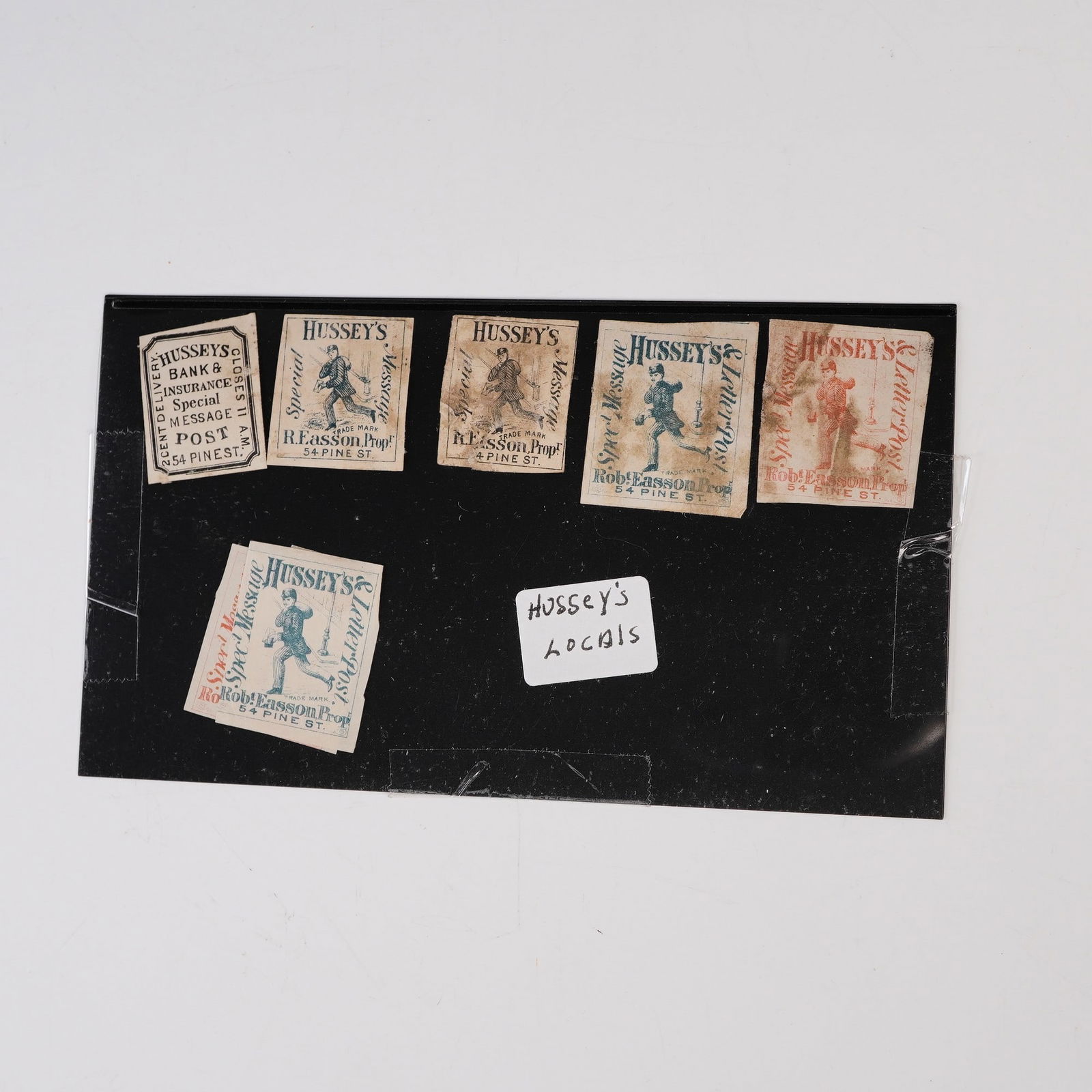 Hussey's Local Special Message Stamps, Group of Seven: Group of seven Hussey's Local Post stamps from New York City, issued during the 1860s and 1870s when private carrier services were active alongside the U.S. postal system. This selection includes mult