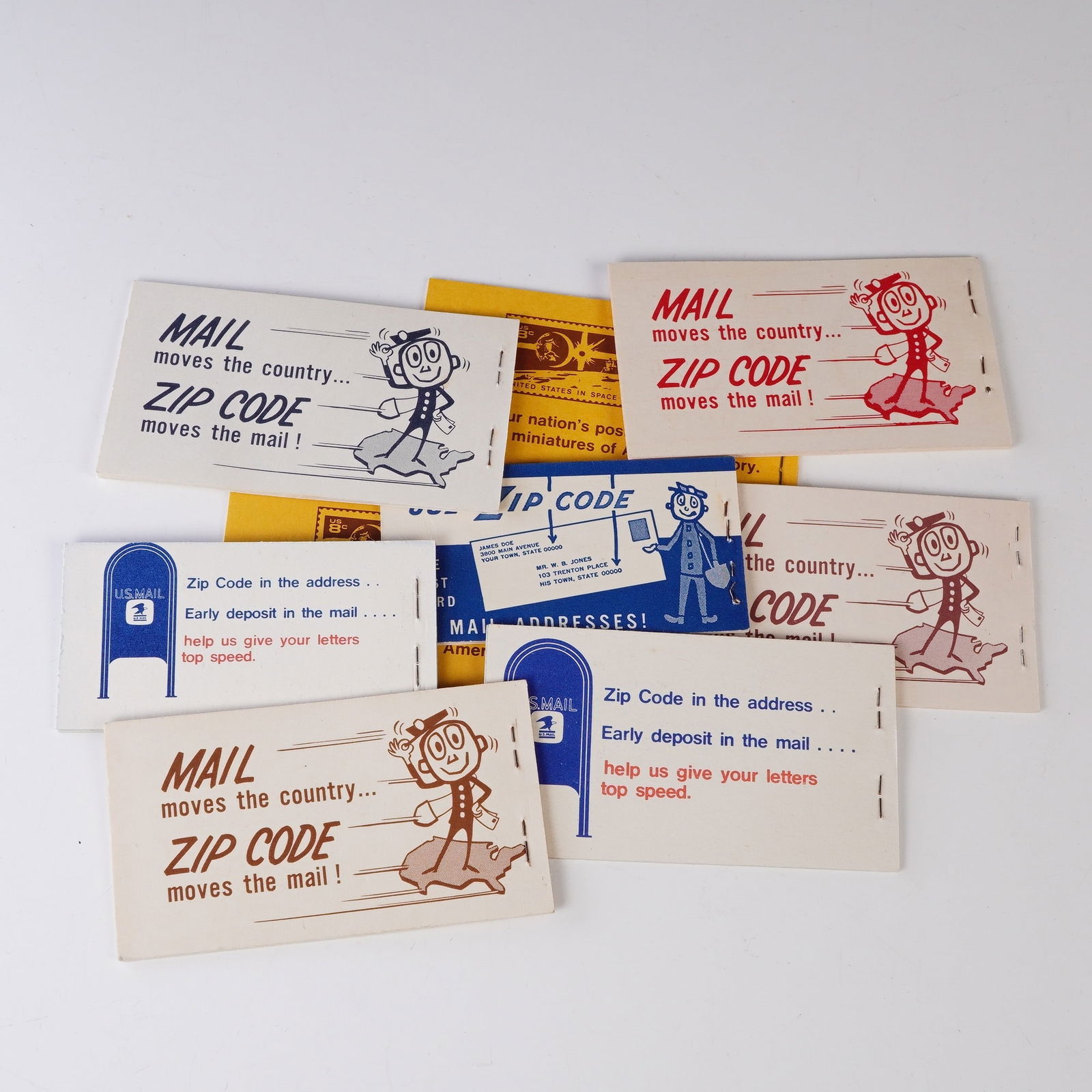 9pc U.S. Stamp Booklets Collection with Air Mail, Eisenhower, Zip Code: This collection includes several vintage U.S. postage stamps, including a set of U.S. Air Mail stamps, an Eisenhower commemorative series, and a series highlighting the importance of Zip Codes. The co