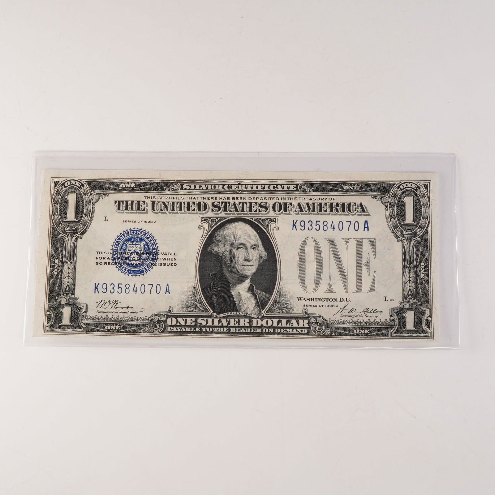 1928A U.S. Silver Certificate One Dollar Note - Uncirculated: Exceptional 1928A U.S. Silver Certificate One Dollar Note, featuring George Washington at center, blue Treasury seal, and serial number K93584070A. This early silver certificate states: "This