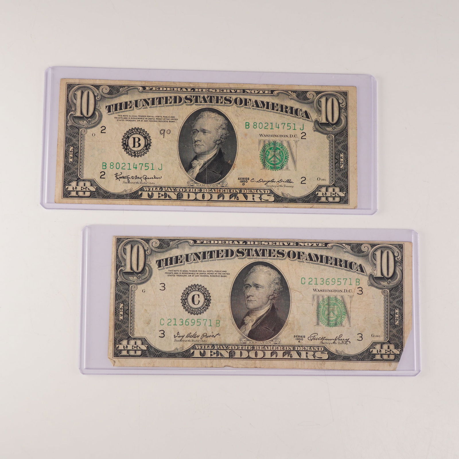 2pc 1950 A,D U.S. Federal Reserve Ten Dollar Notes: U.S. Federal Reserve $10 notes from Series 1950 and 1950D. Each note features the engraved portrait of Alexander Hamilton at center, with green Treasury seal and serial numbers, and the inscription