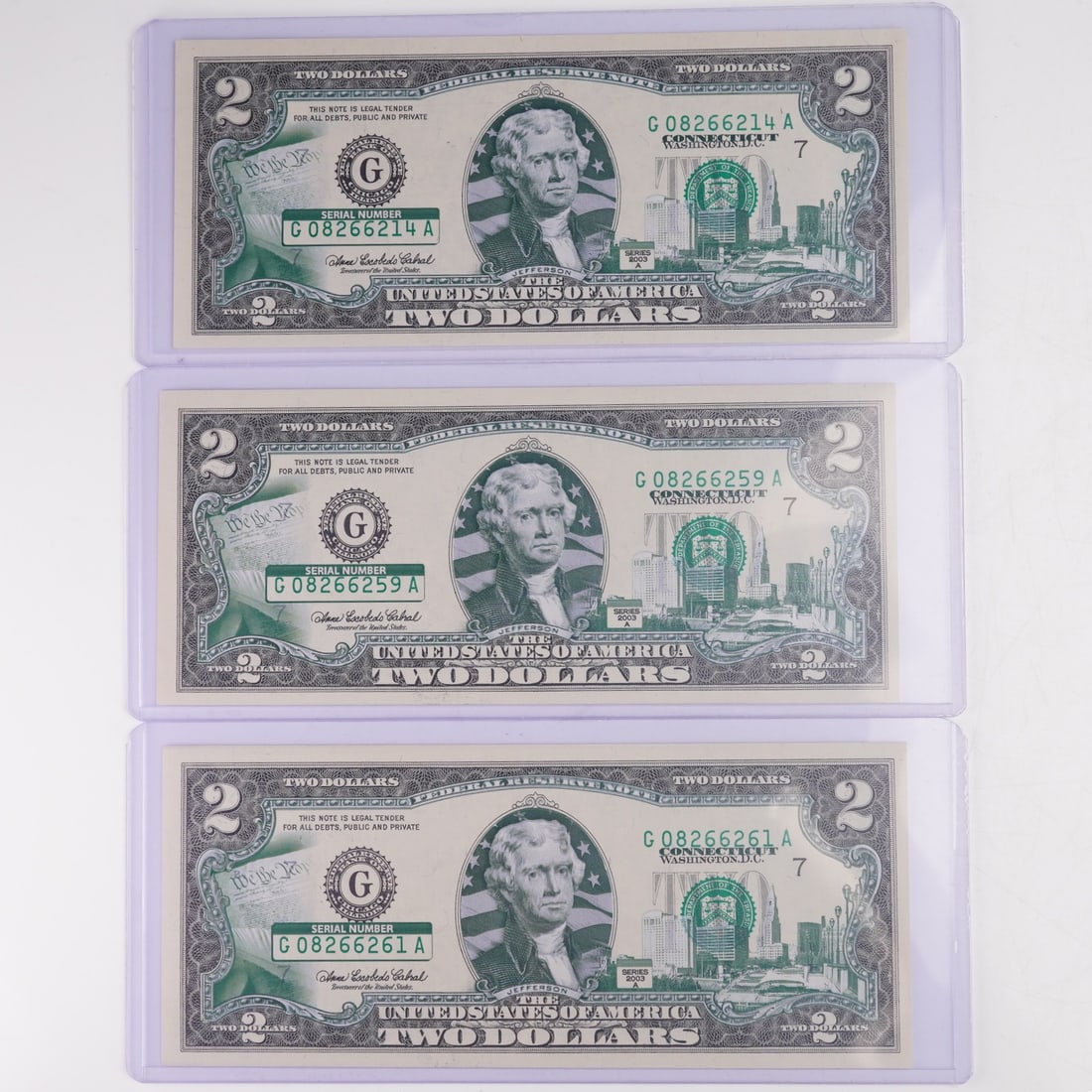 3pc 2003 United States Aftermarket Colorized $2 Federal Reserve Notes: 2003 Series A United States $2 Federal Reserve Notes with aftermarket colorized Connecticut-Hartford skyline overprint. Each note features a portrait of Thomas Jefferson at center on the obverse,