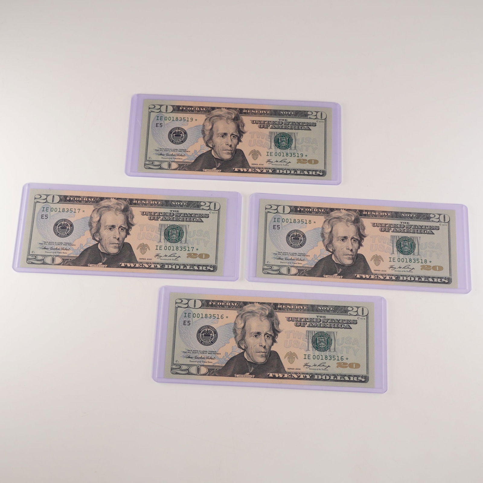 4pc 2006 U.S. Federal Reserve 20 Dollar Consecutive Uncirculated Star Notes: Four consecutive 2006 U.S. Federal Reserve $20 Star Notes, serial numbers IE00183516 through IE00183519. Each note features a portrait of Andrew Jackson on the obverse and a view of the White House on