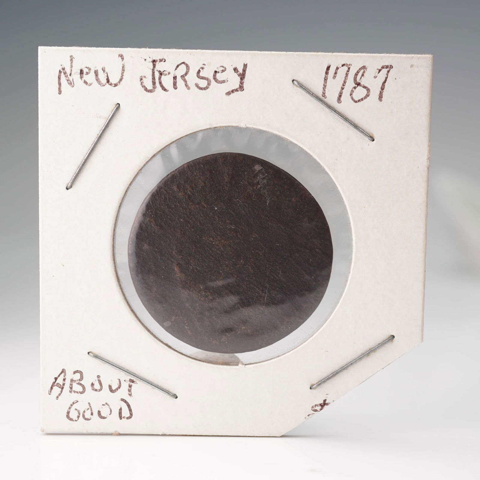 1787 New Jersey Copper Coin: Issued by the State of New Jersey. The obverse design depicts a horse's head above a plow, representing agricultural strength and independence. The reverse displays a shield with thirteen stripes, sym