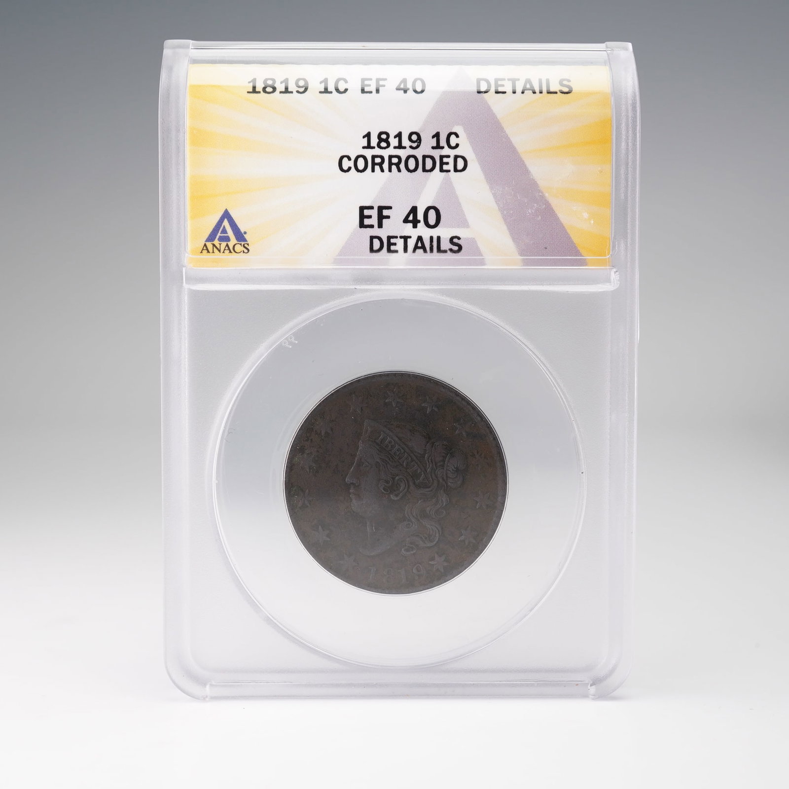 1819 U.S. Liberty Head Large One Cent ANACS Graded EF 40: This 1819 Coronet Head Large Cent, authenticated and graded by ANACS as EF40 Details with a note of corrosion, represents an early 19th-century issue from the United States Mint's copper centage. The 