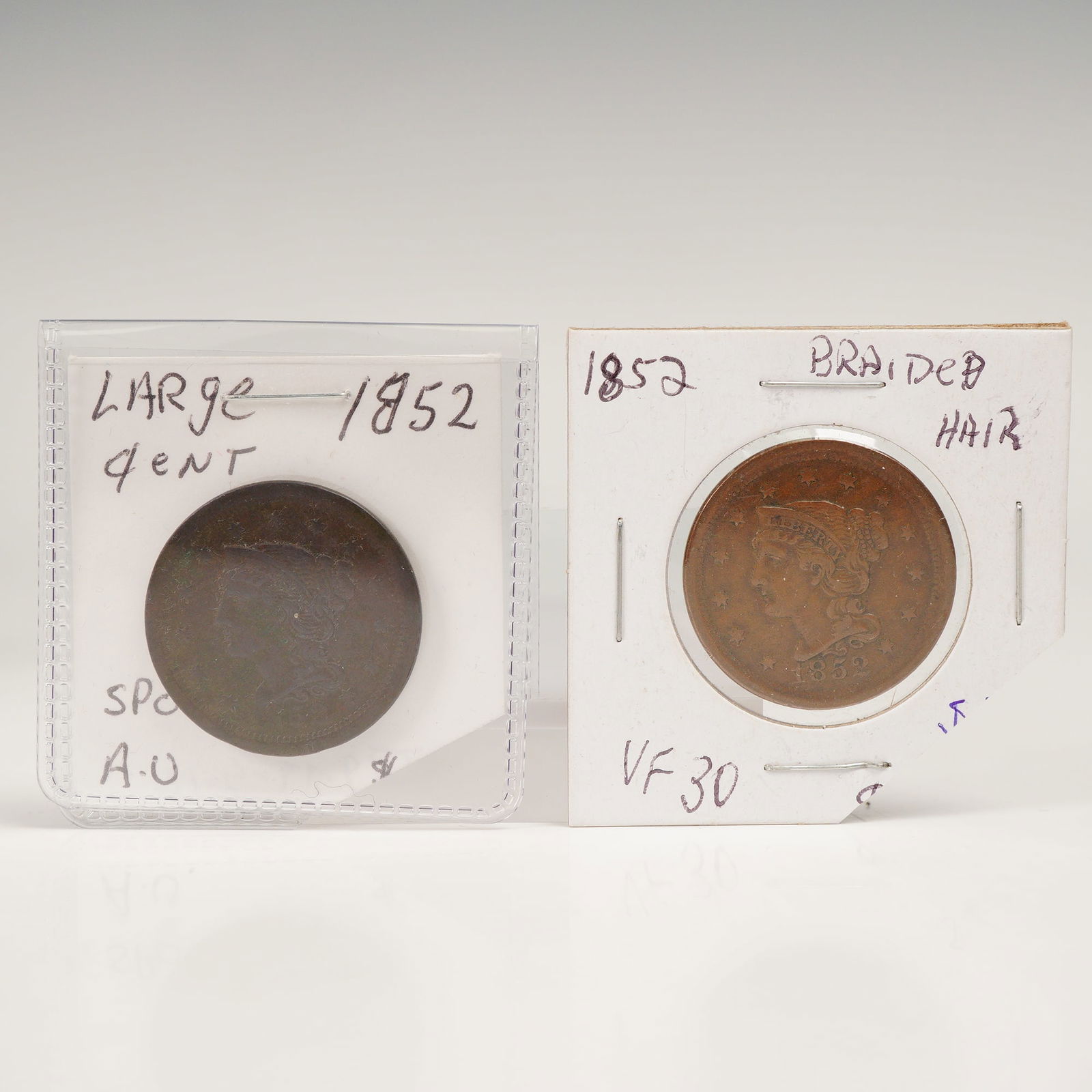 2pc 1852 U.S. Braided Hair Large One Cent Coins: 1852 United States Braided Hair Large Cents, struck in copper during the final decade of large cent production prior to the denomination's discontinuation in 1857. The obverses depict Liberty facing l