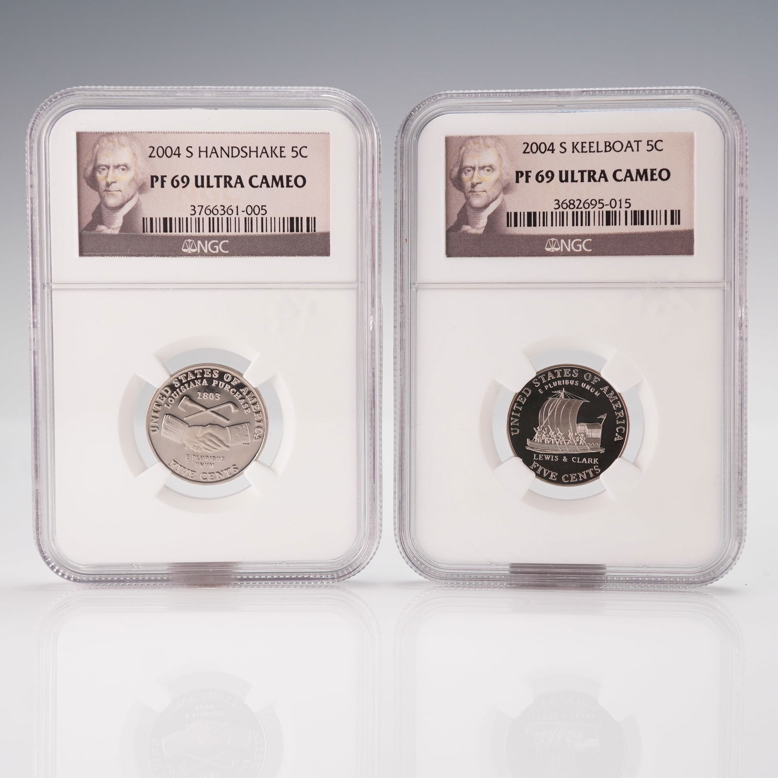 Two 2004 S Jefferson 'Westward Journey' Nickels, Handshake and Keelboat: This lot features two 2004 U.S. five-cent coins, commonly known as nickels, from the Westward Journey series. Both coins are professionally encapsulated and graded by NGC as PF 69 ULTRA CAMEO, indicat