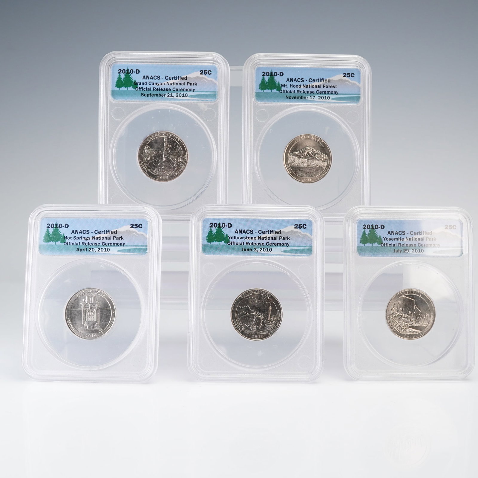 5pc 2010-D America the Beautiful Quarters Official Release ANACS Certified: Comprising all five designs from the inaugural year of the America the Beautiful Quarters program, this 2010-D set includes Hot Springs National Park, Yellowstone National Park, Yosemite National Park