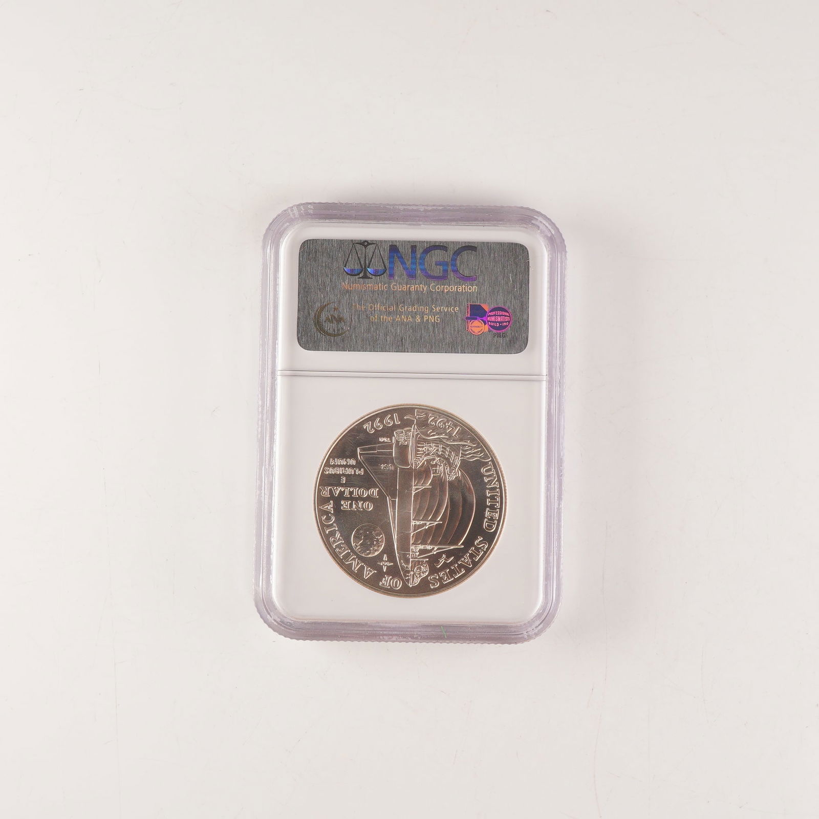 1992-D Columbus Commemorative Silver Dollar, NGC MS69: This 1992-D Columbus Quincentenary Commemorative Silver Dollar, graded MS69 by the Numismatic Guaranty Corporation (NGC), was struck at the Denver Mint to honor the 500th anniversary of Christopher Co
