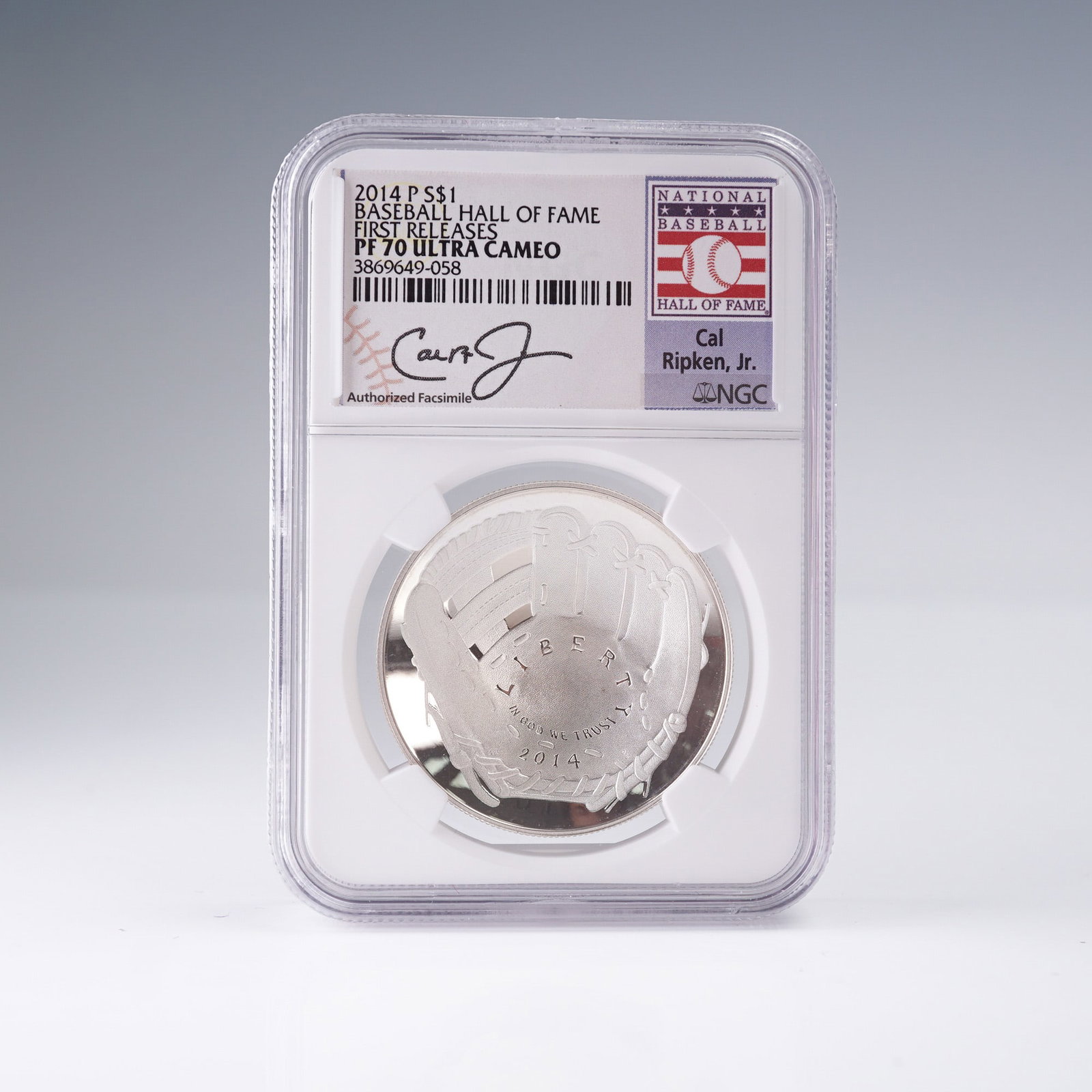 2014-(P) Baseball Hall Of Fame First Release Dollar Coin NGC Graded PF-70: Commemorative Silver Dollar, certified by NGC as PF 70 Ultra Cameo with a Cal Ripken Jr. label and designated First Releases. Struck at the Philadelphia Mint, this concave Proof coin features a baseba