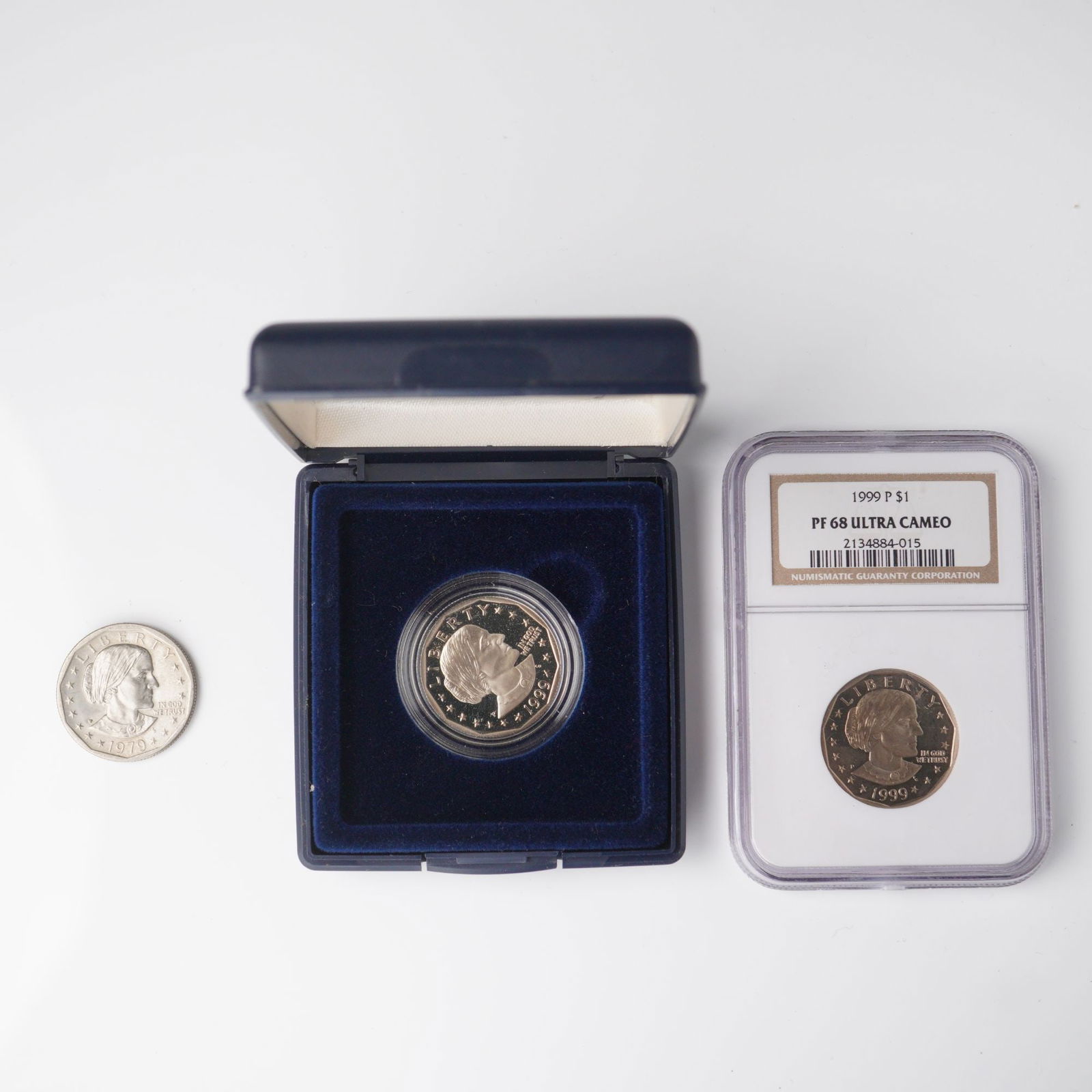 3pc 1979 - 1999-P Susan B. Anthony One Dollar Coins: A three piece collection of 1999 Susan B. Anthony dollars featuring one certified example NGC Graded PF 68 Ultra Cameo, one U.S. Mint issued proof coin, and one ungraded circulation strike. Each coin