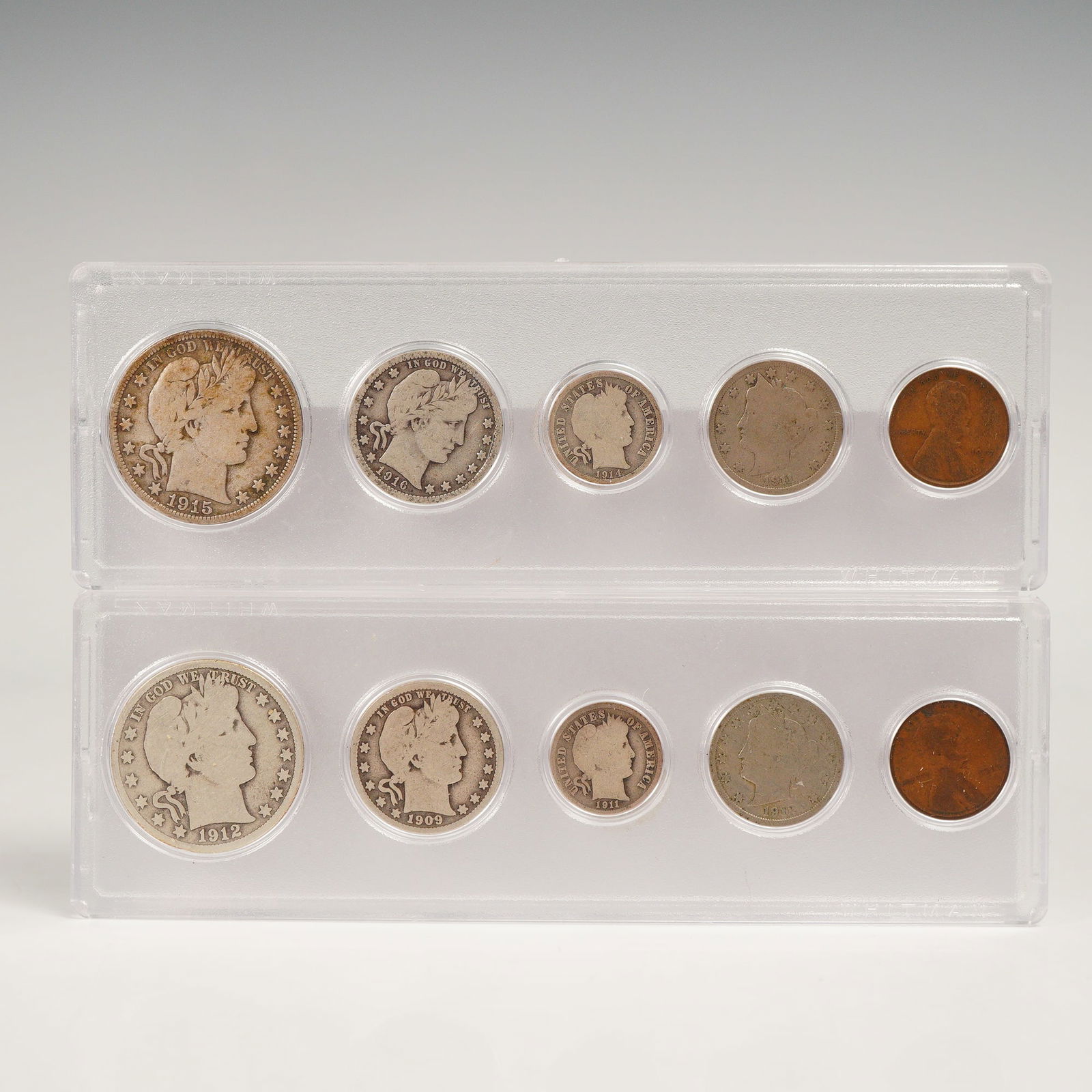 2pc 1909-1917 United States Coin Sets: Features early 20th century United States coinage arranged in clear plastic display holders. One set includes a 1915-D Barber Half Dollar, 1916 Barber Quarter Dollar, 1914-D Barber Dime, 1911 Nickel,