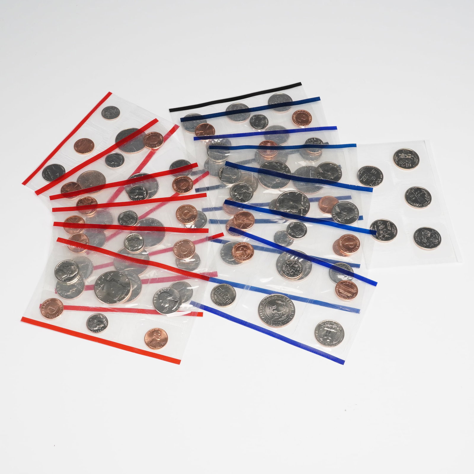 14pc 1987, 1989, 1992, 1994, 1998, 2000 U.S. Mint Uncirculated Coin Sets: Group of uncirculated coin sets, each set features coins struck at the Philadelphia and Denver Mints in their original Mint-issued packaging with envelopes and inserts as shown. Included are two Ameri