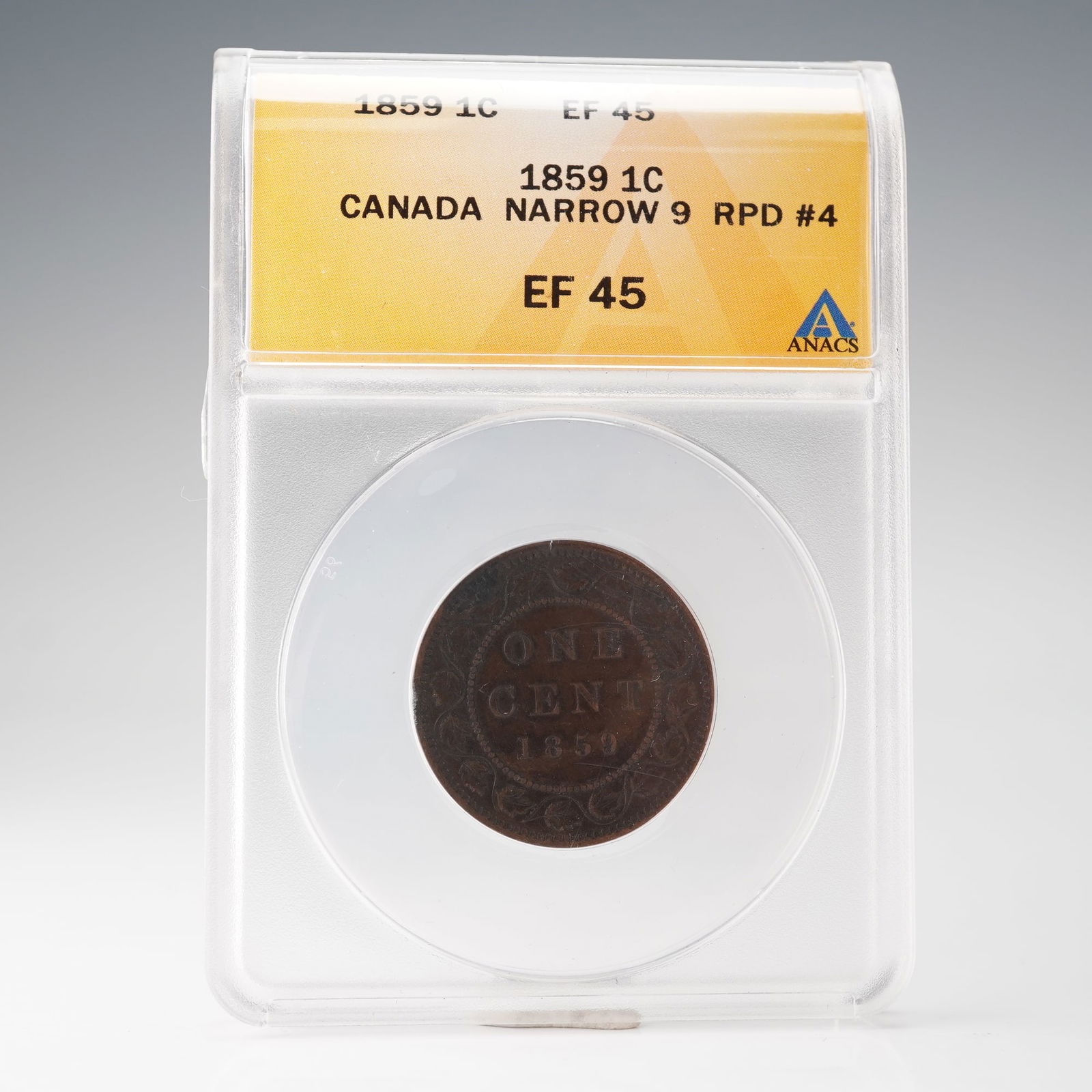 1859 Canada Narrow 9 1 Cent ANACS Graded EF-45 RPD 4 Coin: Struck in bronze for the Province of Canada, this pre-Confederation cent features the laureate bust of Queen Victoria on the obverse, surrounded by the inscription VICTORIA DEI GRATIA REGINA CANADA. T