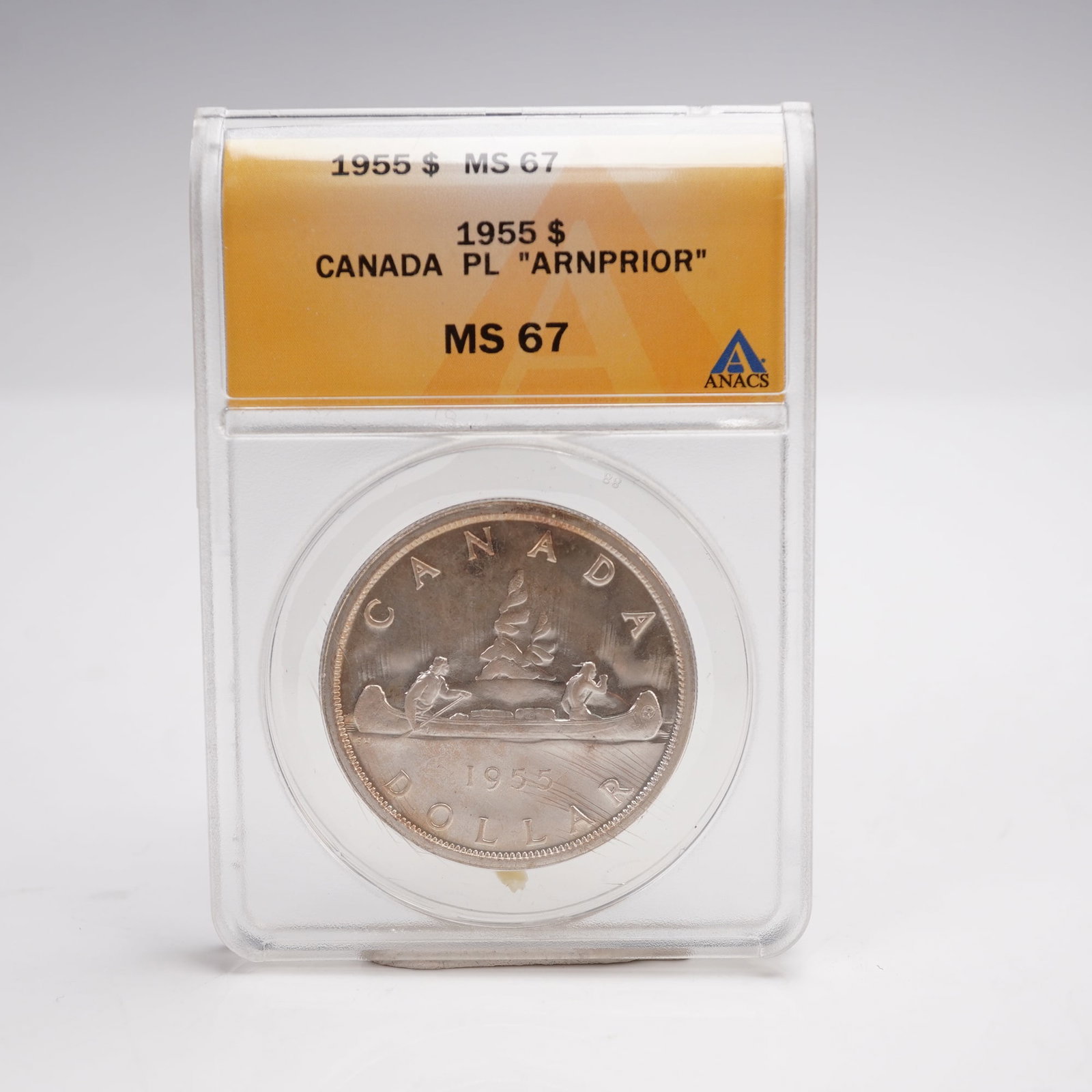 1955 Canada PL Arnprior Dollar Coin ANACS Graded MS-67: This dollar coin is composed of 80% silver and 20% copper, with a total weight of 23.33 grams and an actual silver weight of 0.600 troy ounces. The obverse features the laureate portrait of Queen Eliz