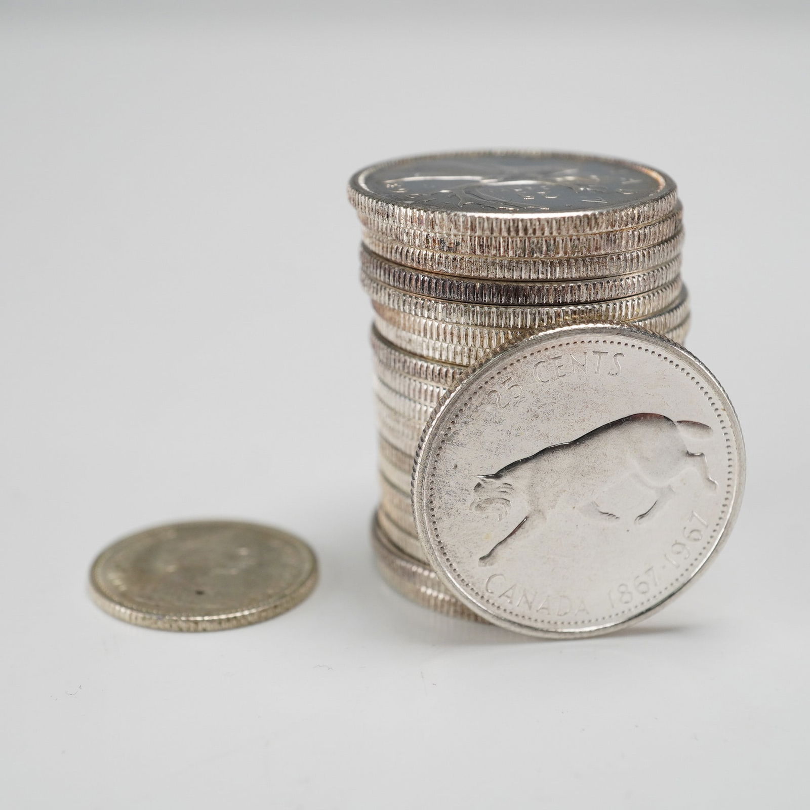 1967 Canada Centennial Twenty-Five and Ten Cent Coins, 21 Coins: Canadian 1967 Centennial circulating coinage consisting of both twenty-five cent and ten cent denominations, issued to commemorate the 100th anniversary of Canadian Confederation (1867-1967). Designed