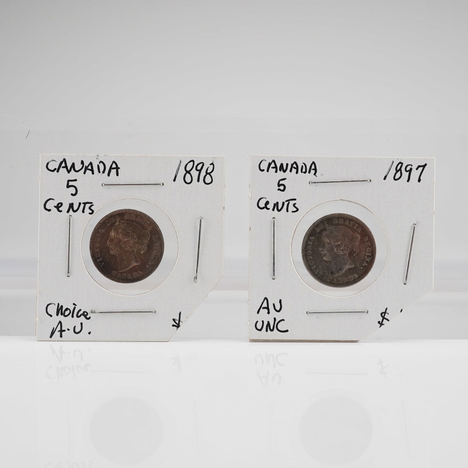 A Pair of Late Victorian Canadian 5-Cent Coins 1897 and 1898: This is a pair of Canadian 5-cent coins, dated 1897 and 1898, issued during the late Victorian period. Both coins feature the laureate portrait of Queen Victoria on the obverse, surrounded by the lege