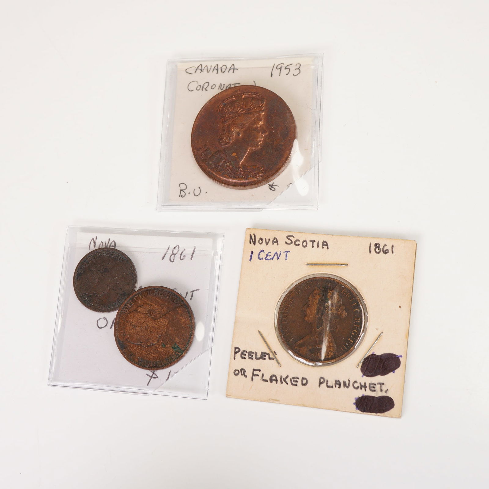 4pc Canadian 1861 Flaked Planchet Victoria Coins & 1953 Elizabeth II Coin: Includes one 1953 Canada Coronation commemorative coin depicting Queen Elizabeth II on the obverse with inscriptions ELIZABETH II DEI GRATIA REGINA and CANADA on the reverse surrounding the crowned mo