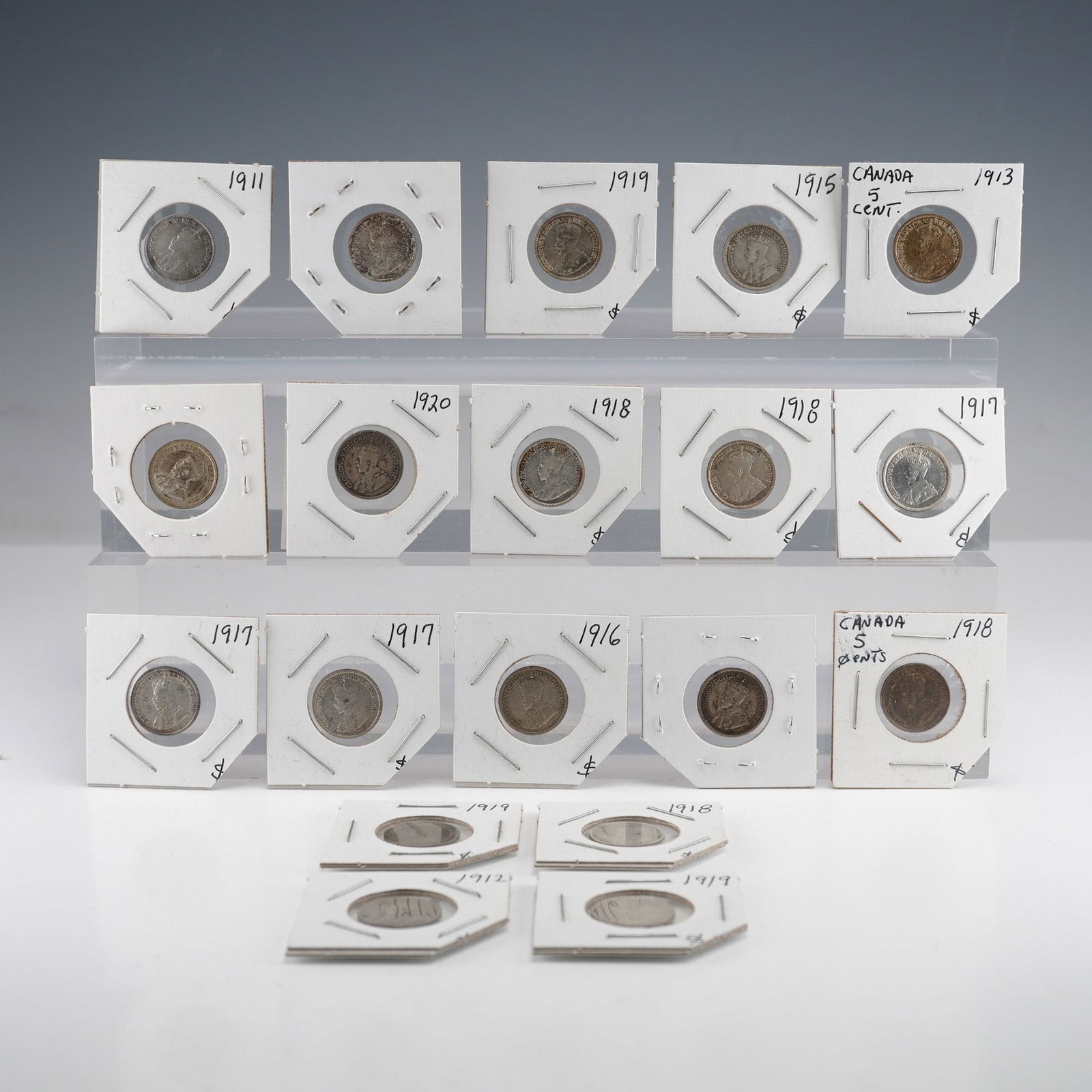 19pc Canadian 5 Cents Silver Coin Collection, George V Series: A collection of 19 Canadian 5 Cents silver coins issued during the reign of King George V. The obverse features the Laureate Bust design. The reverse displays the denomination and date encircled by a